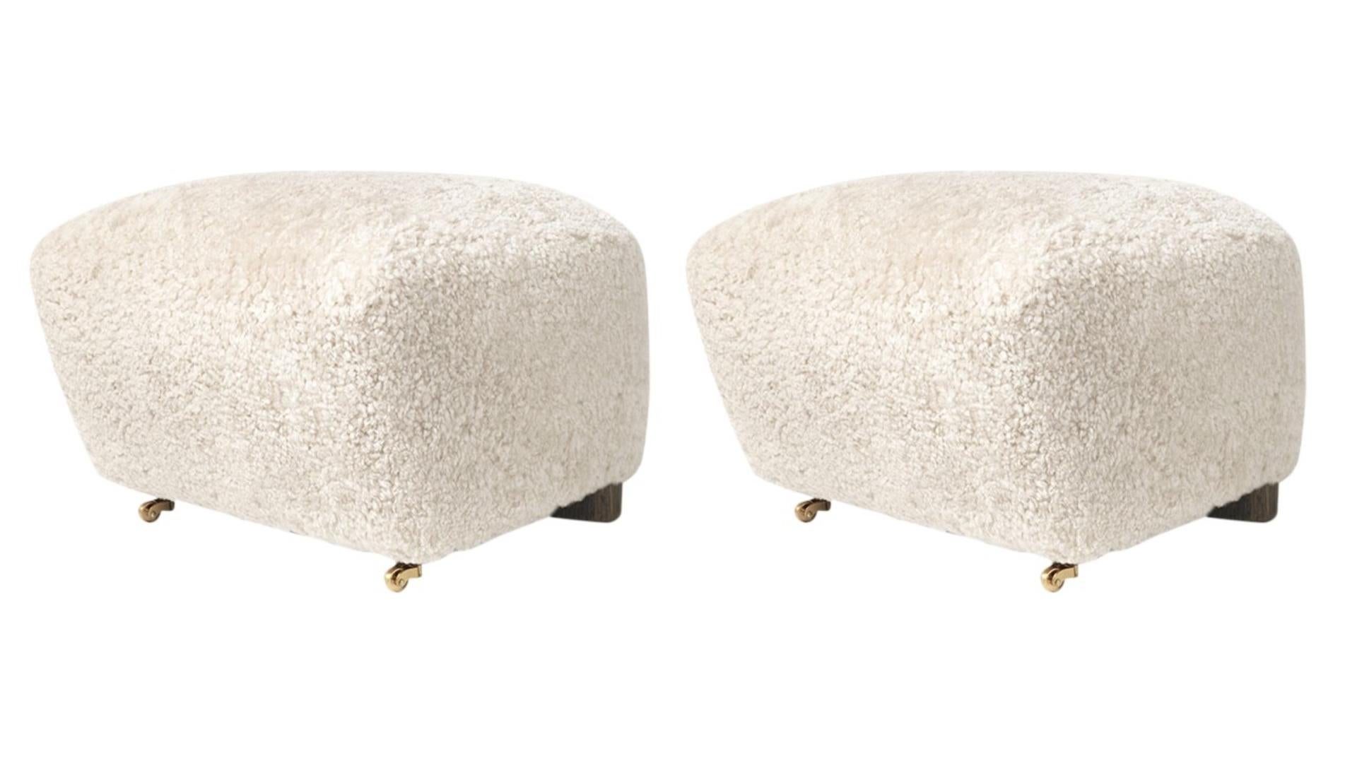 Set of 2 off white smoked oak sheepskin The Tired Man footstools by Lassen
Dimensions: W 55 x D 53 x H 36 cm 
Materials: Sheepskin

Flemming Lassen designed the overstuffed easy chair, The Tired Man, for The Copenhagen Cabinetmakers’ Guild