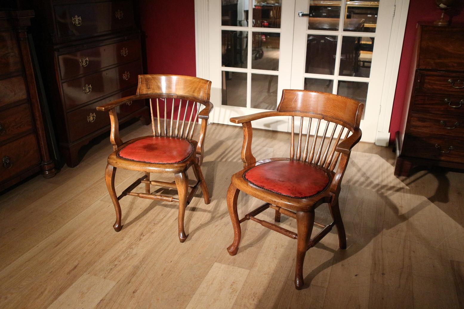 Beautiful set of antique office chairs. One is in oak and one is in beech in good and very solid condition. Warm color.
Origin: England
Period: circa 1900
Measures: width 60cm, depth 48cm, height 88cm. armrest height 70cm.
 