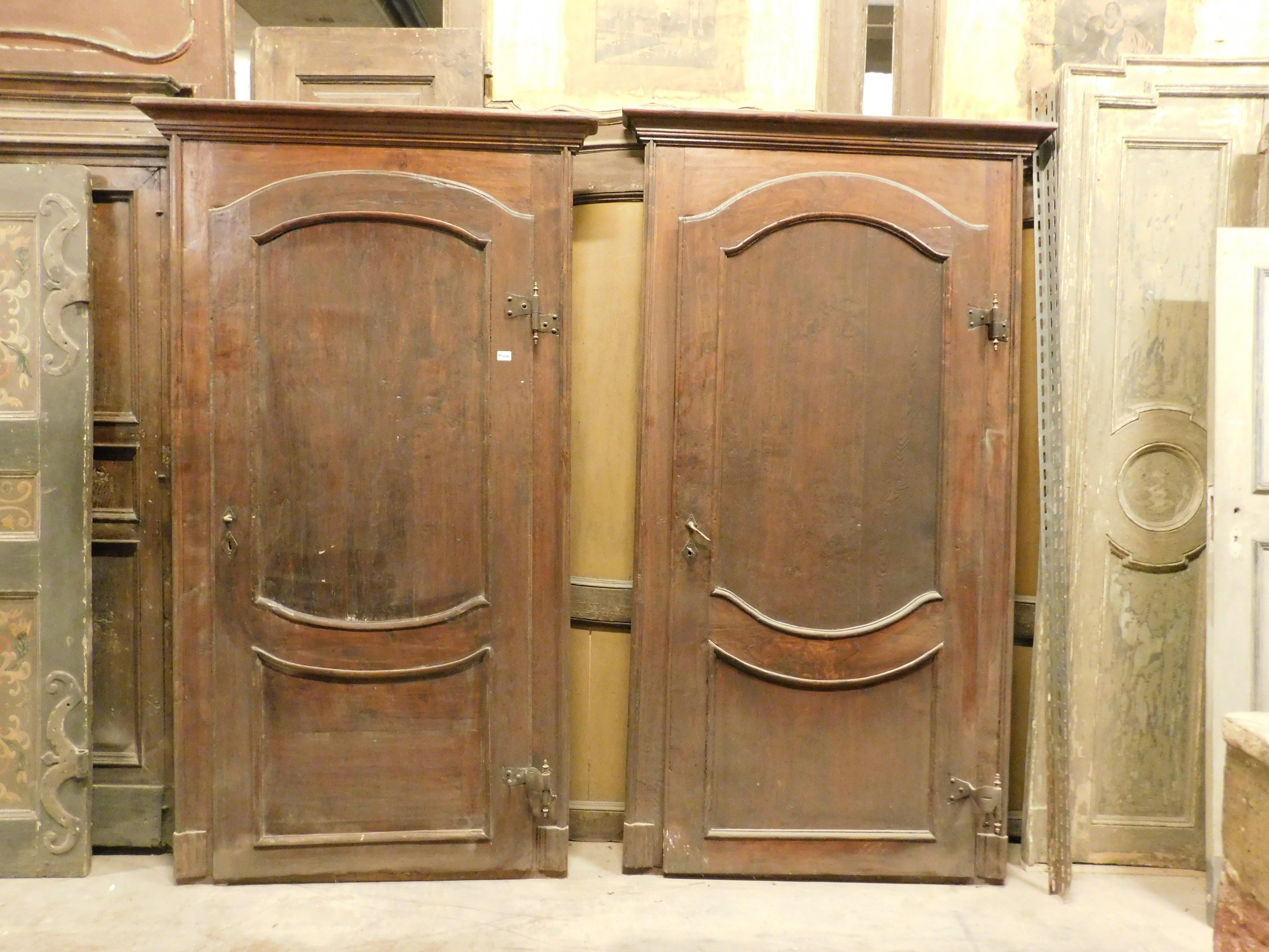 set of N. 2 antique doors in solid poplar wood, hand-carved with baroque wavy panel and complete with original frame, internal doors with a curved leaf, Complete with original frame and irons, Pull opening to the right, Smooth back, From the 18th