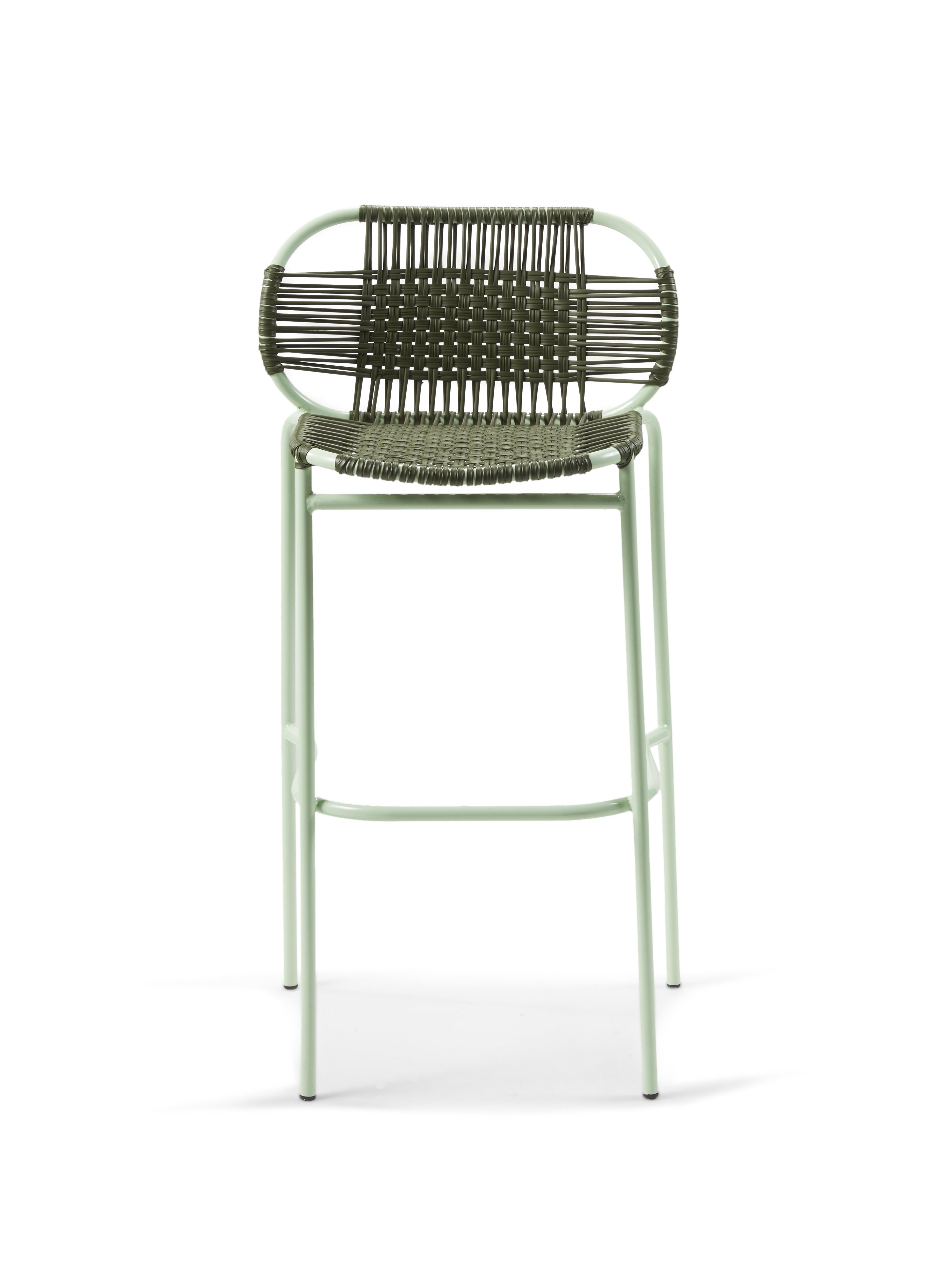 Set of 2 olive Cielo bar stool by Sebastian Herkner
Materials: galvanized and powder-coated tubular steel. PVC strings are made from recycled plastic.
Technique: made from recycled plastic and weaved by local craftspeople in Cartagena, Colombia.