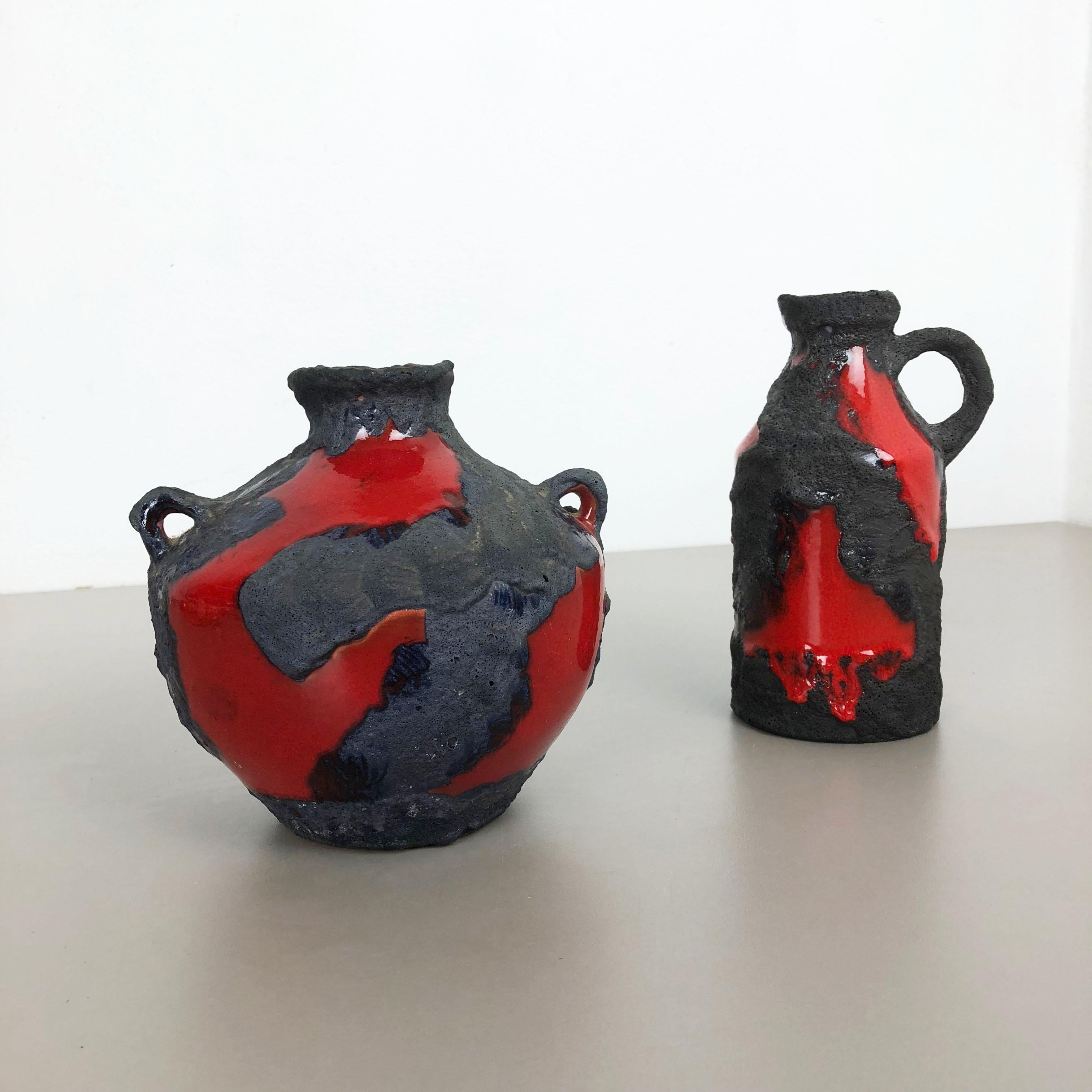 Article:

Ceramic fat lava vases set of 2


Producer:

Marei Ceramics, Germany


Decade:

1970s



Description:

Set of 2 original vintage Studio Pottery vases was produced in the 1970s by Marei Ceramics, Germany. Rare set of 2