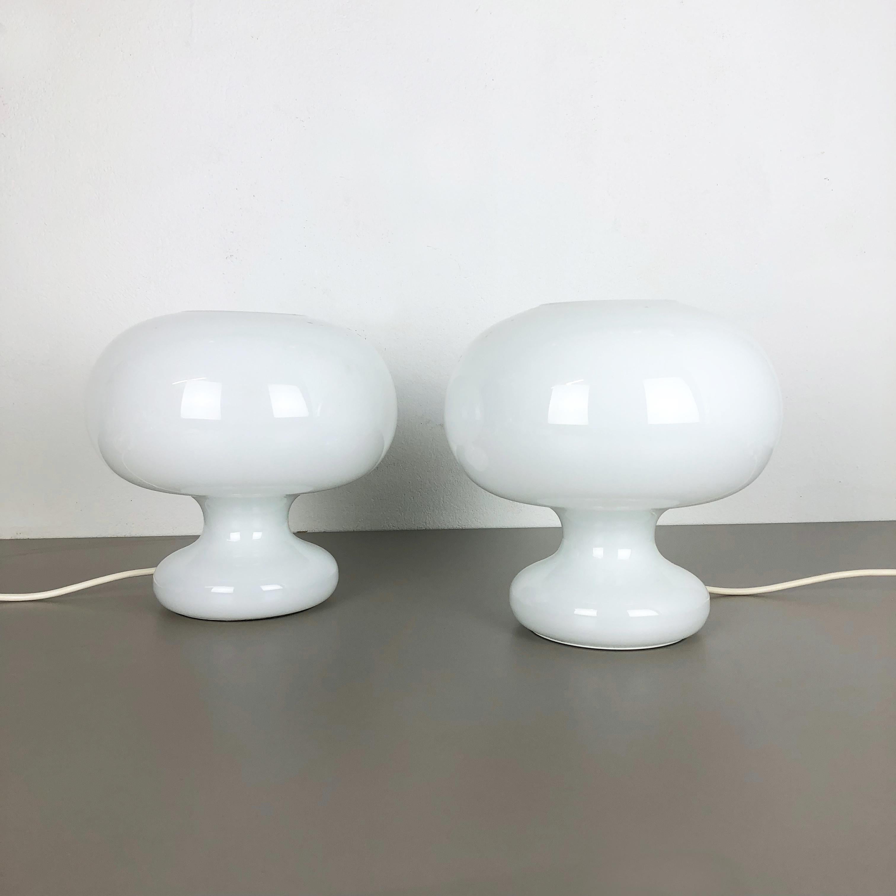 Article:

Mushroom desk lamp set of 2

Producer:

Cosack Lights, Germany

Age:

1970s


Description:

This original set of 2 vintage table lights made of high quality handblown glass was produced by German premium light producer