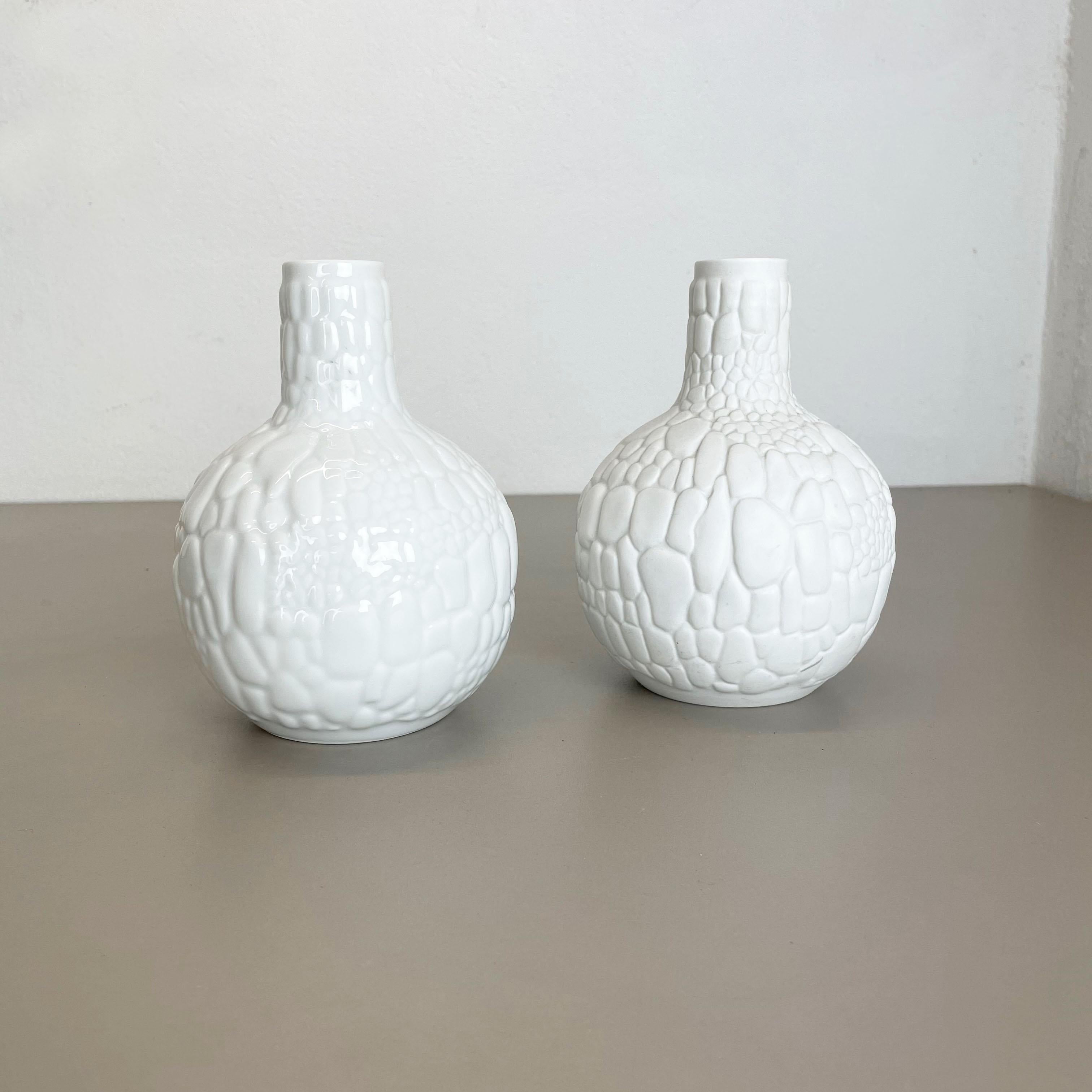 Article:

Op Art porcelain vase set o 2


Producer:

AK Kaiser, Germany


Description:

This original vintage OP Art Vase was produced in the 1970s in Germany. it is made of porcelain with an OP Art rock surface optic. the bottom is