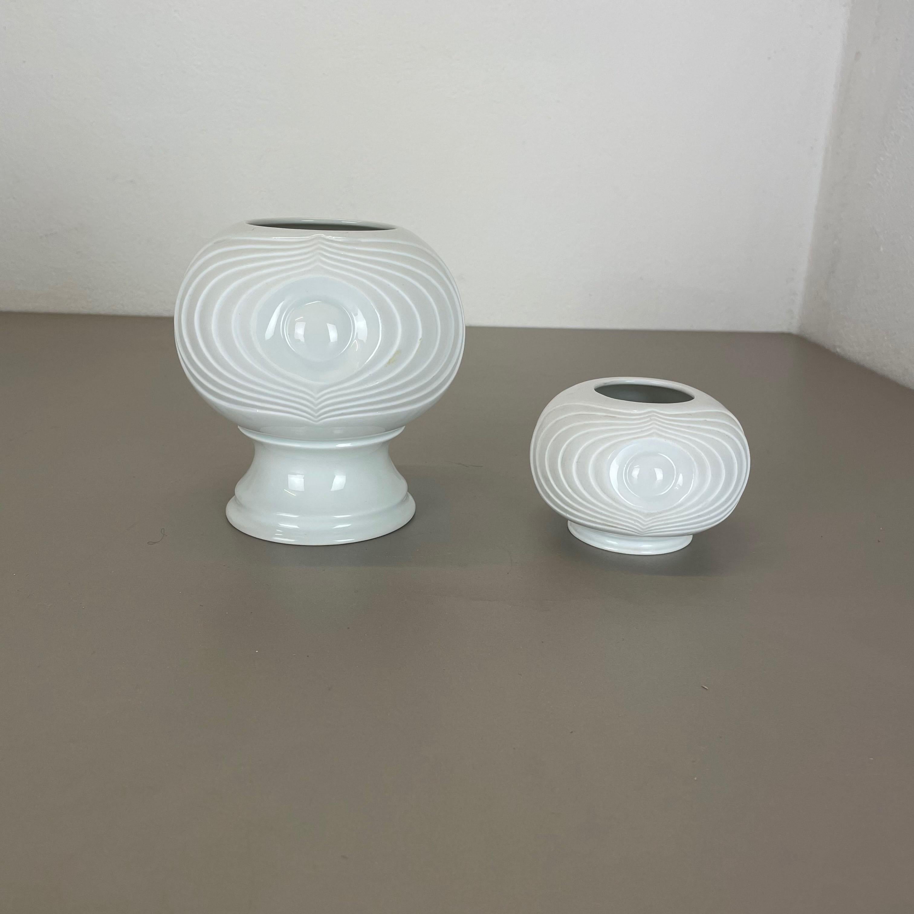 Article:

OP Art porcelain vase set


Producer:

Royal Bavaria KPM Germany


 

This original vintage OP Art vase set was produced in the 1970s in Germany. It is made of porcelain with an OP Art abstract formed surface.
The bottom is