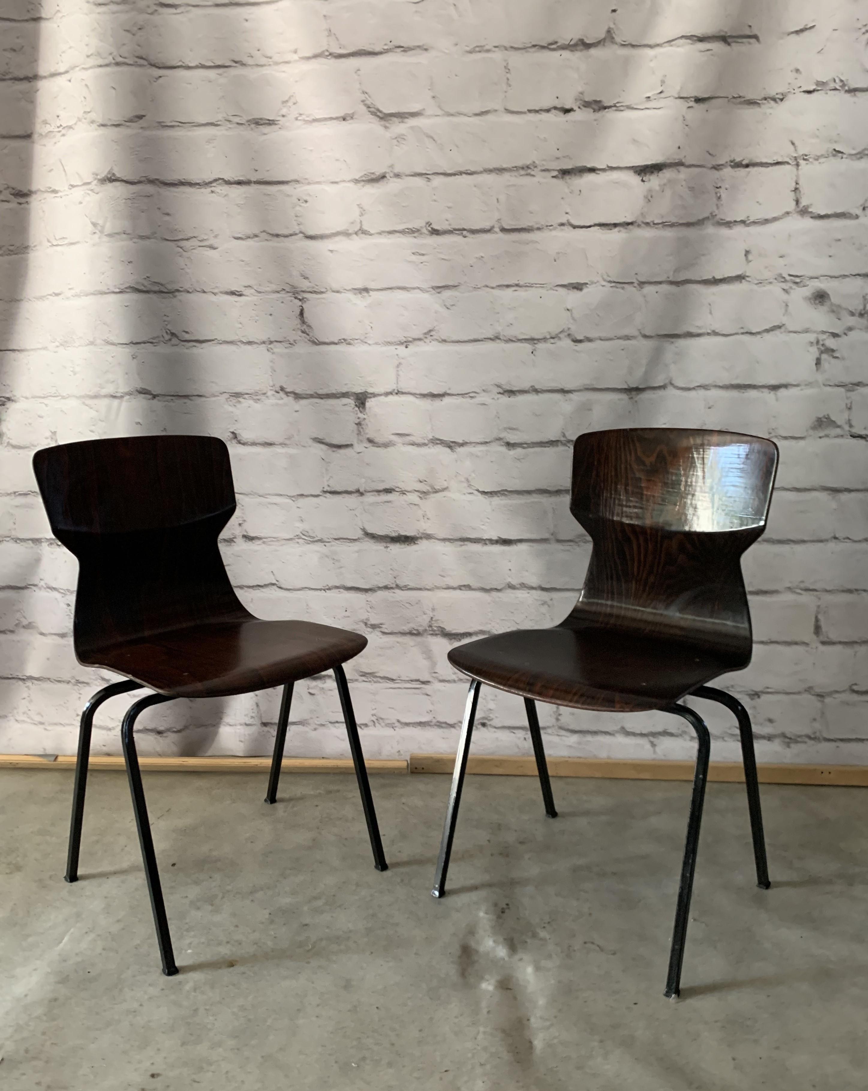 Vintage chairs from the 60's. Pagholz (pagwood) it's the combination of wood and resin made with the extreme pressure power. The result is the material of beauty of wood, in this case rosewood and the hardiness of plastic