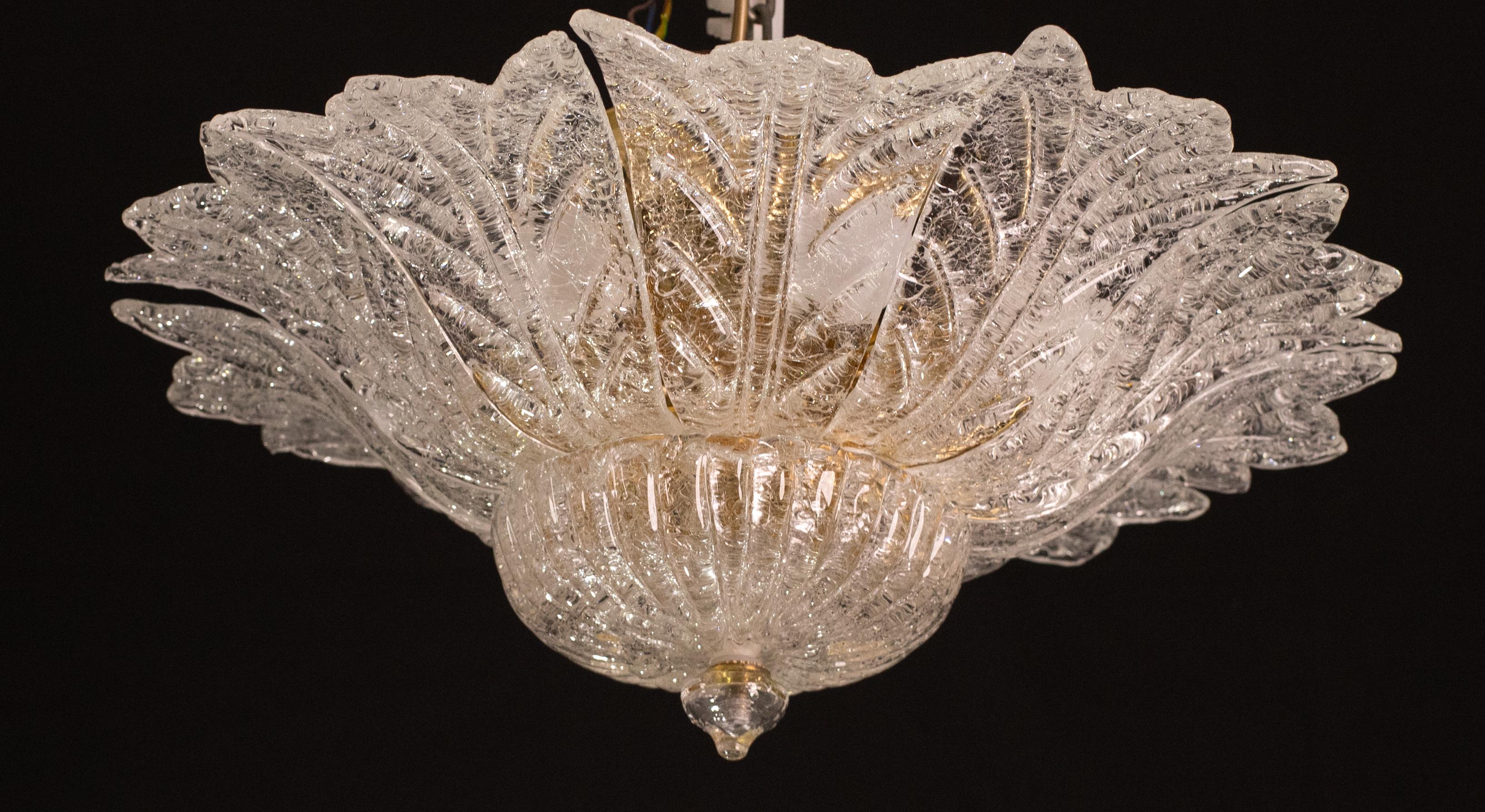 Set of 2 Splendid Murano glass ceiling lamp.

Period: circa 1970.

The light mounts 7 standard European e14 lamp holders, possible to switch for Usa.

Perfect for decorating a large space.

Height measures 30 centimeters from the ceiling, diameter