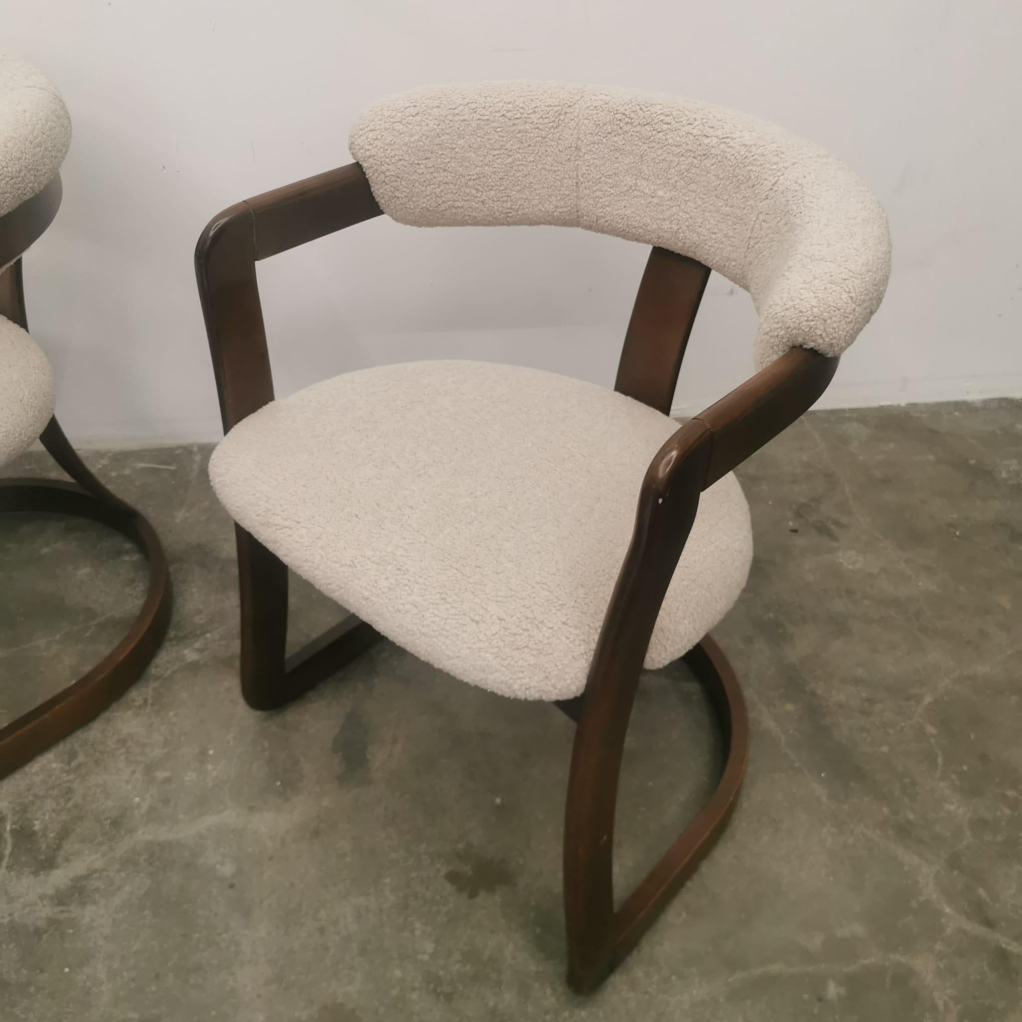 The set of two Pamplona style chairs brings a touch of timeless elegance and comfort to any interior space. Crafted from sturdy, high-quality wood, these chairs boast a classic design with a modern twist. The combination of the wooden frame and the
