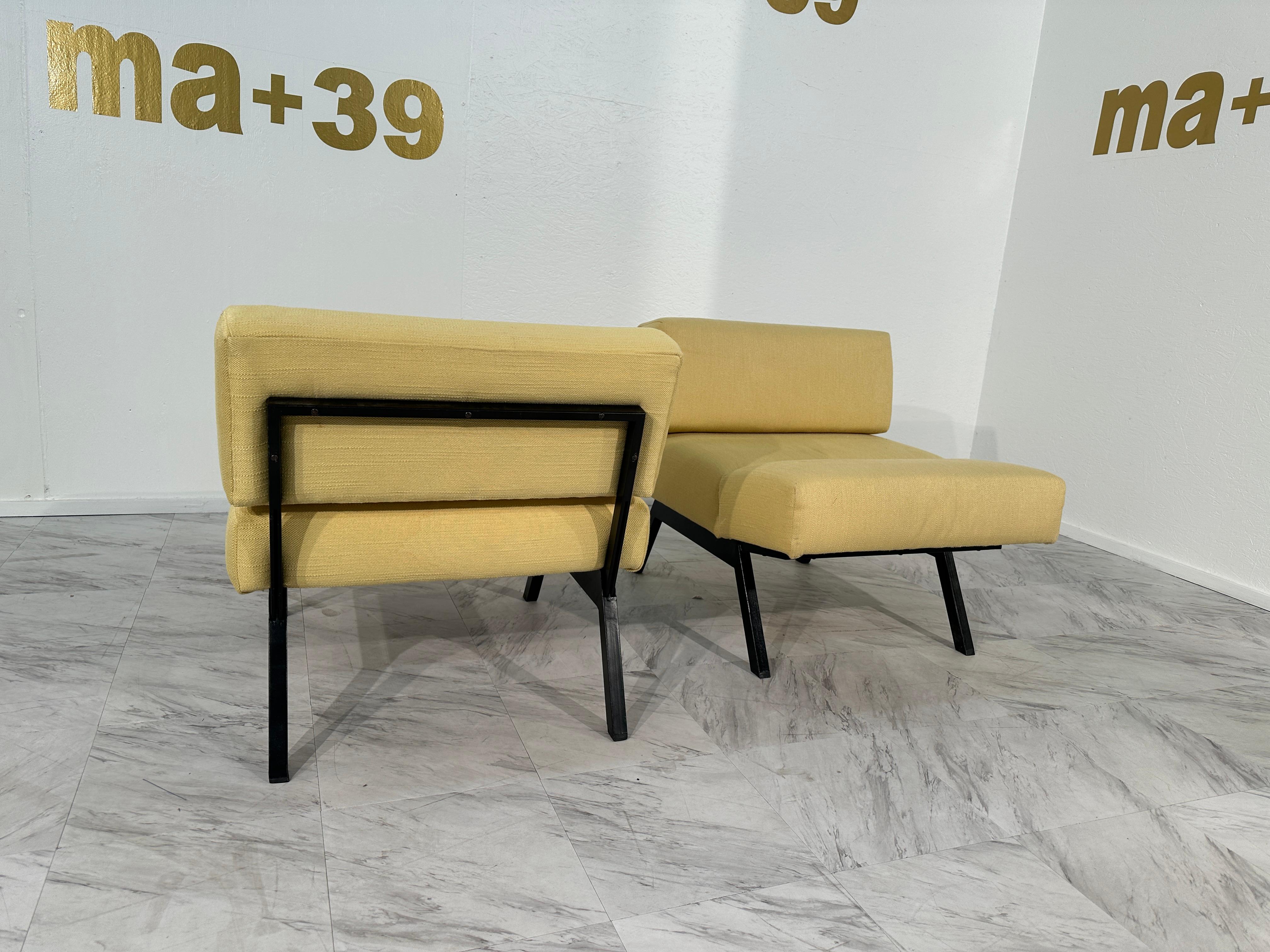 The Set of 2 Panchetto Lounge Chairs, designed by Rito Valla for IPE Bologna in the 1960s, represents an iconic blend of mid-century Italian craftsmanship and innovative design. These lounge chairs boast a distinctive silhouette with their