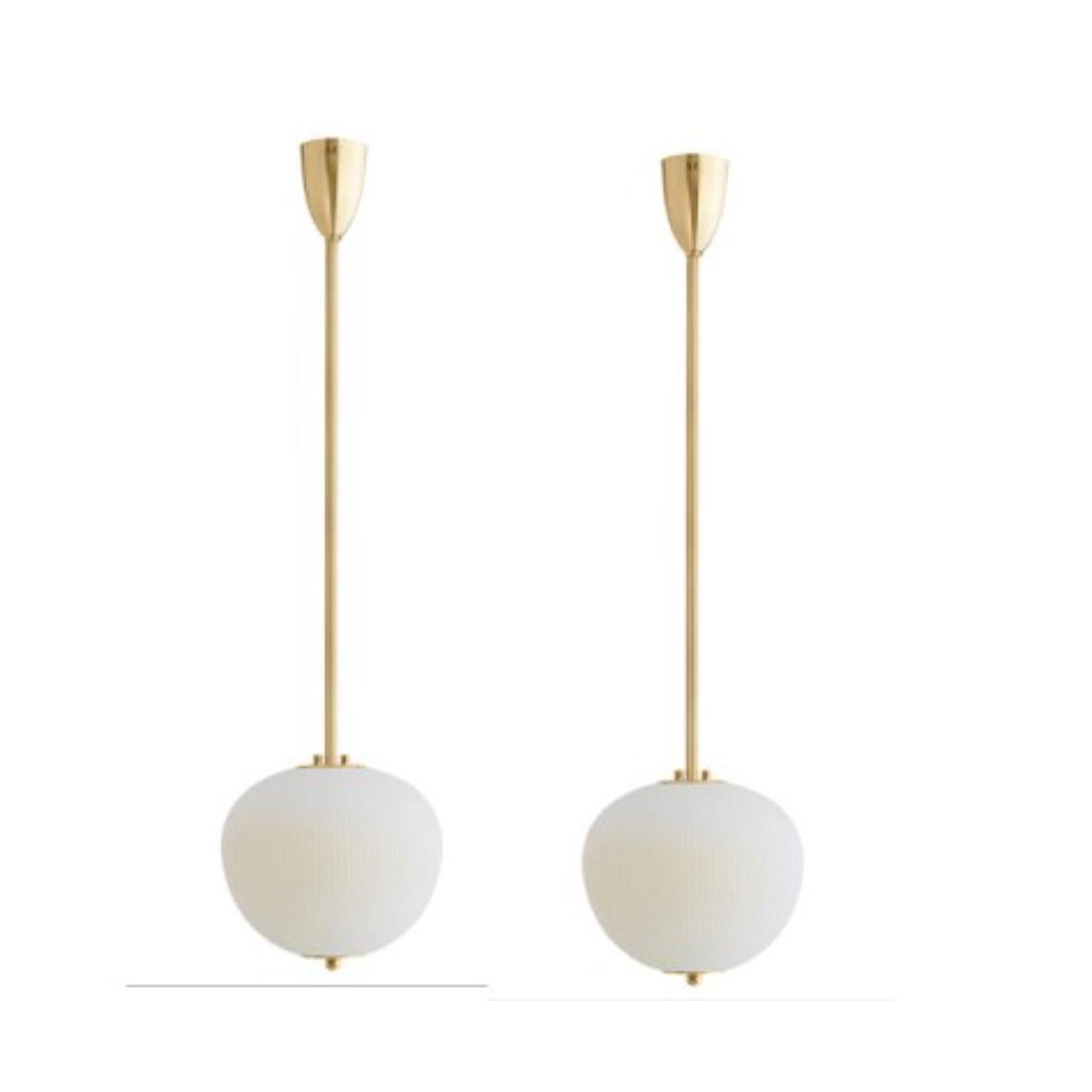 Pendant China 03 by Magic Circus Editions.
Dimensions: H 90 x W 26.2 x D 26.2 cm, also available in H 110, 130, 150, 175, 190.
Materials: brass, mouth blown glass sculpted with a diamond saw.
Colour: ivory

Available finishes: brass,