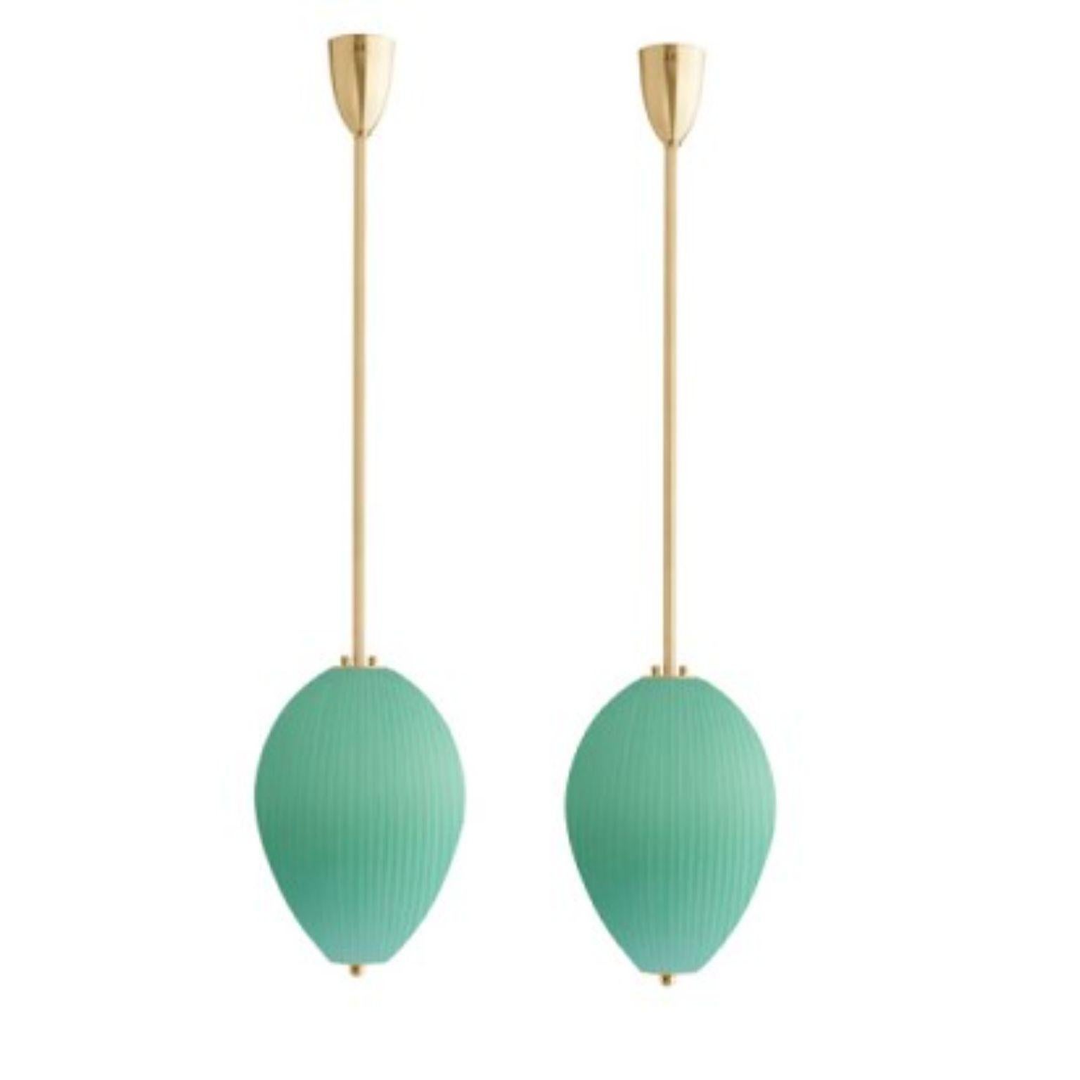 Pendant China 10 by Magic Circus Editions.
Dimensions: H 90 x W 25.2 x D 25.2 cm, also available in H 110, 130, 150, 175, 190 cm.
Materials: brass, mouth blown glass sculpted with a diamond saw.
Colour: jade green

Available finishes: brass,