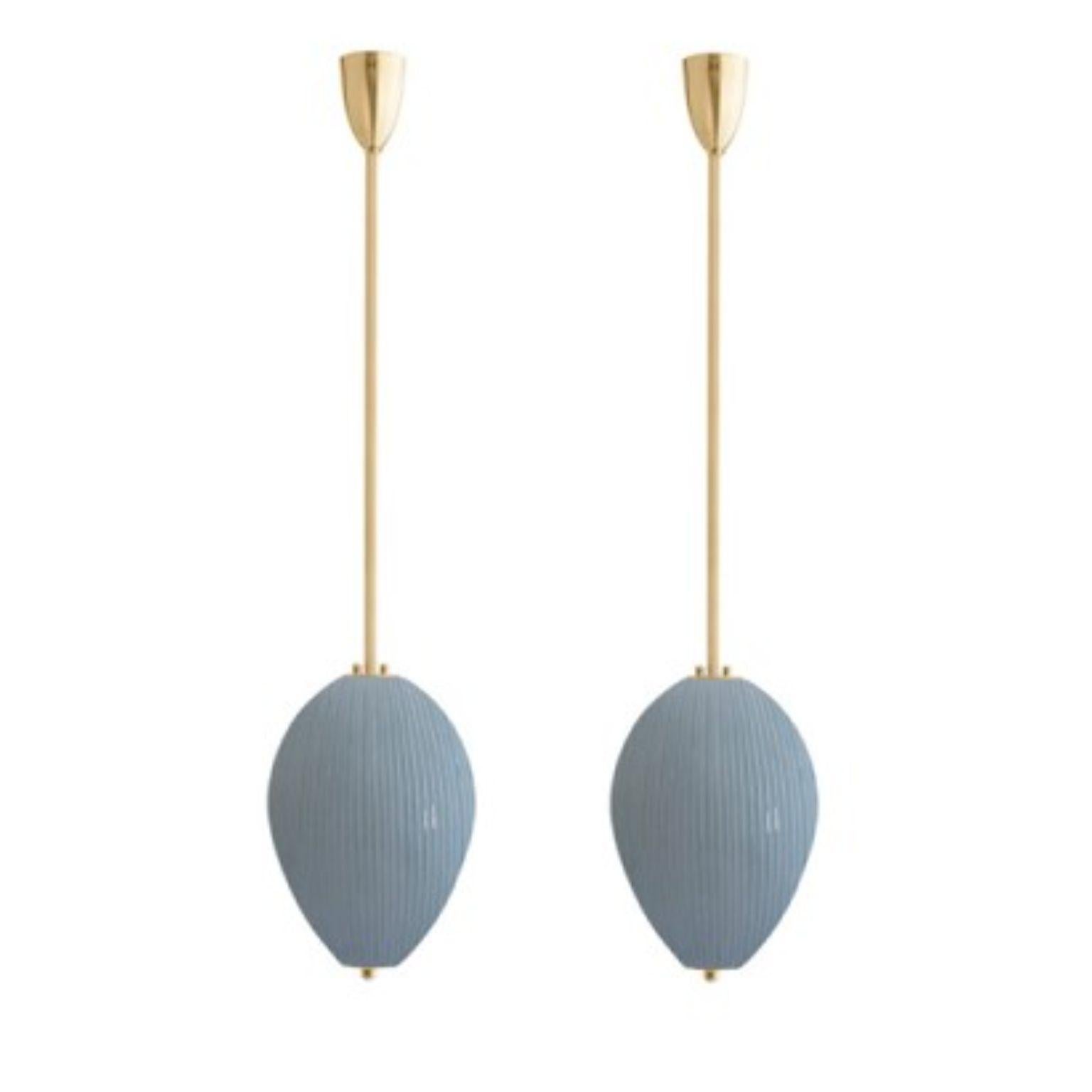 Pendant China 10 by Magic Circus Editions
Dimensions: H 90 x W 32 x D 32 cm, also available in H 110, 130, 150, 175, 190 cm
Materials: Brass, mouth blown glass sculpted with a diamond saw
Colour: opal grey

Available finishes: Brass,