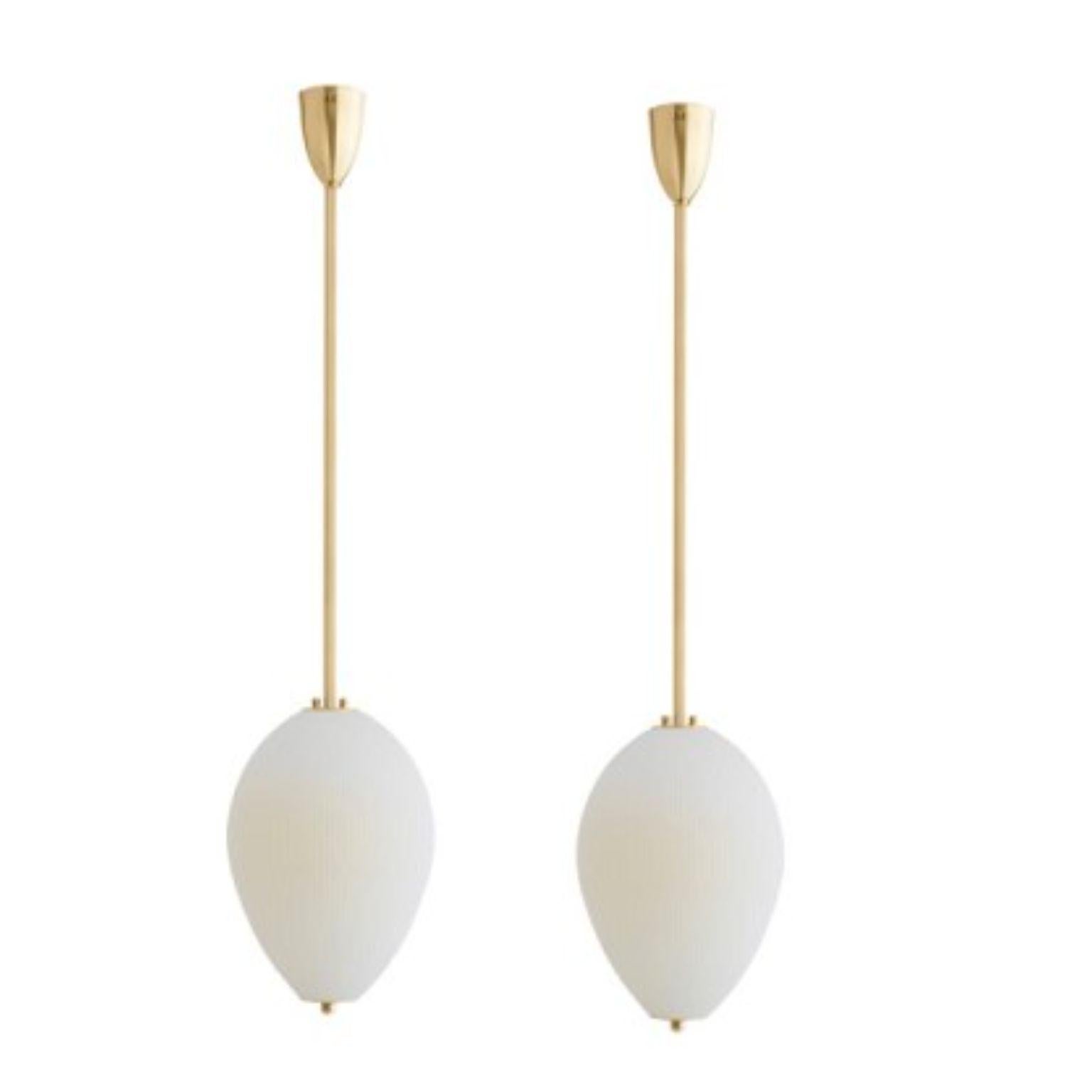 Pendant China 10 by Magic Circus Editions
Dimensions: H 90 x W 32 x D 32 cm, also available in H 110, 130, 150, 175, 190 cm
Materials: brass, mouth blown glass sculpted with a diamond saw
Color: ivory

Available finishes: brass, nickel
Available