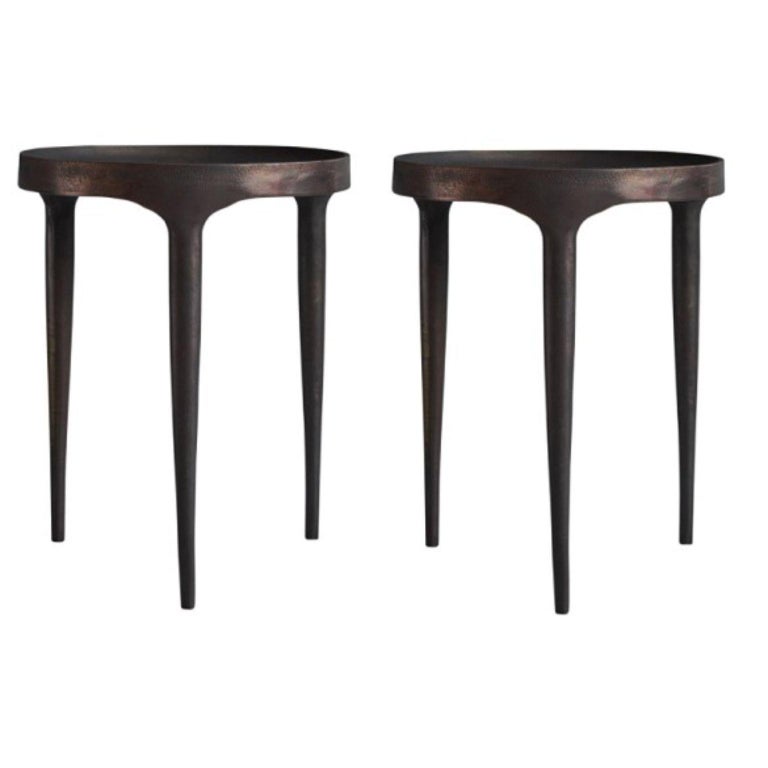Set of 2 Phantom tables tall by 101 Copenhagen
Designed by Kristian Sofus Hansen & Tommy Hyldahl
Dimensions: L40 / W40 /H50 CM
Materials: Cast Iron

Characterized by its intentional naive and handmade expression and raw, unpolished surface, the