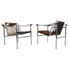 Set aus 2 Sesseln aus Ponyhaut, Modell LC1 von Le Corbusier für Cassina, Italien, 1970er Jahre