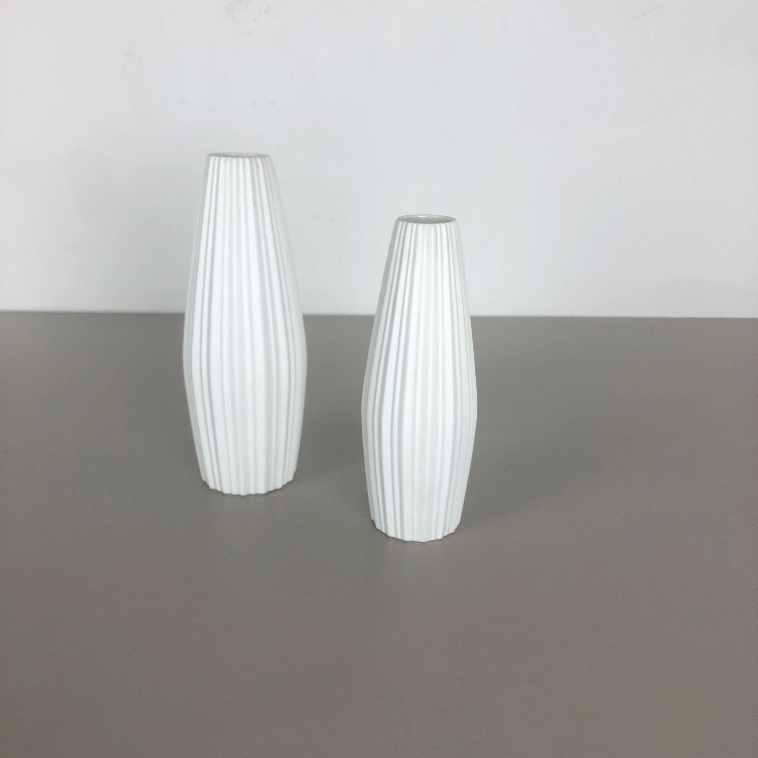 Article:

Op Art porcelain vase set of 2


Producer:

Heinrich Selb Bavaria, Germany


Decade:

1970s



This original vintage Op Art vase was produced in the 1970s in Germany. It is made of porcelain with an Op Art Surface.
The