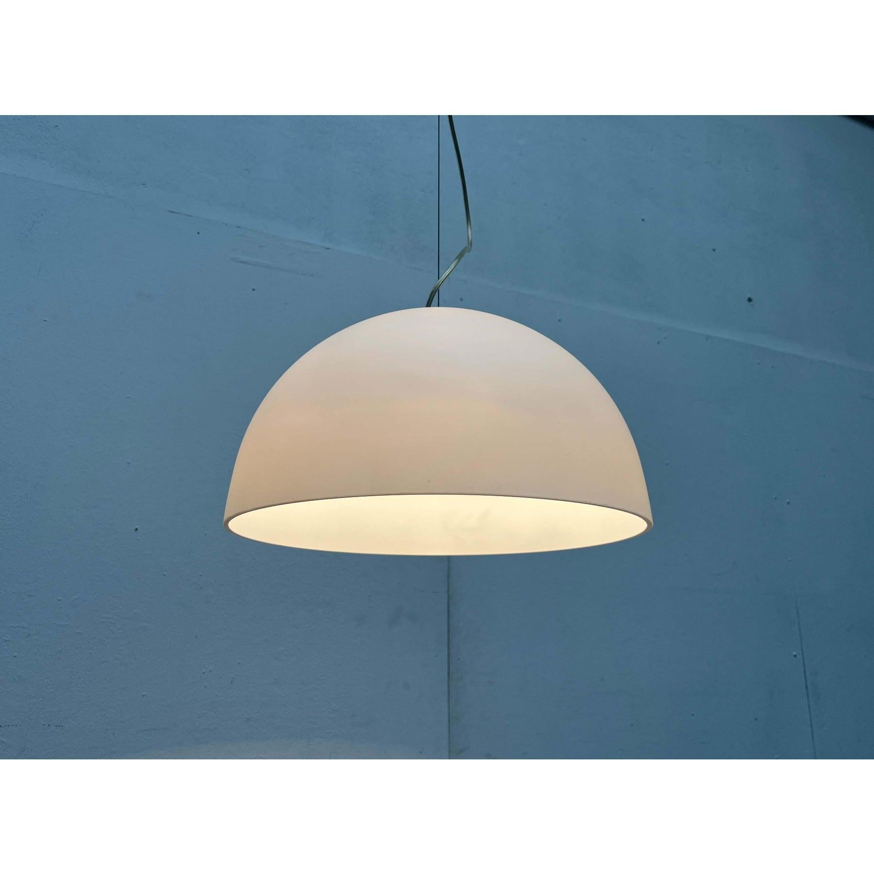 Postmodern glass pendant lights from the italian manufacturer tre ci luce based on a design by luciano cesaro.

the simple hemispherical shape of the glass shades is striking. The lights hang on wire ropes. The supply cable is routed in loops to
