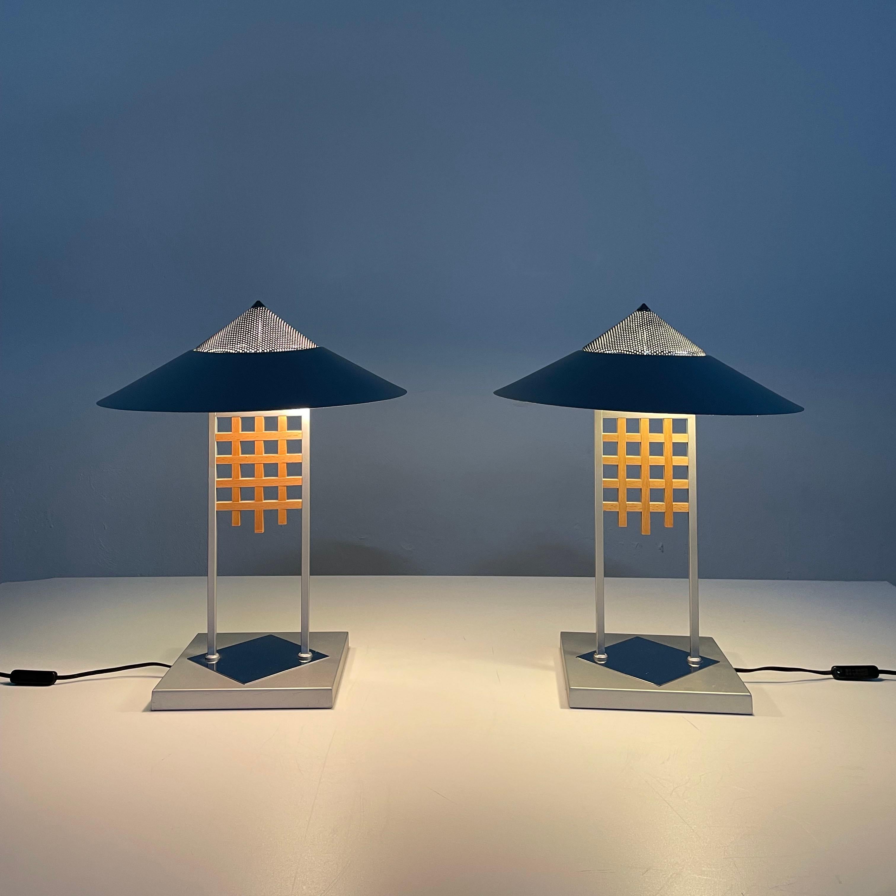 Pair of beautiful metal and table lamps with wooden decoration produced by Slovenian lighting company Sijaj Hrastnik in the 1980's / 1990's

The Slovenian company Sijaj Hrastnik was known in Former Yugoslavia for the great quality of production and