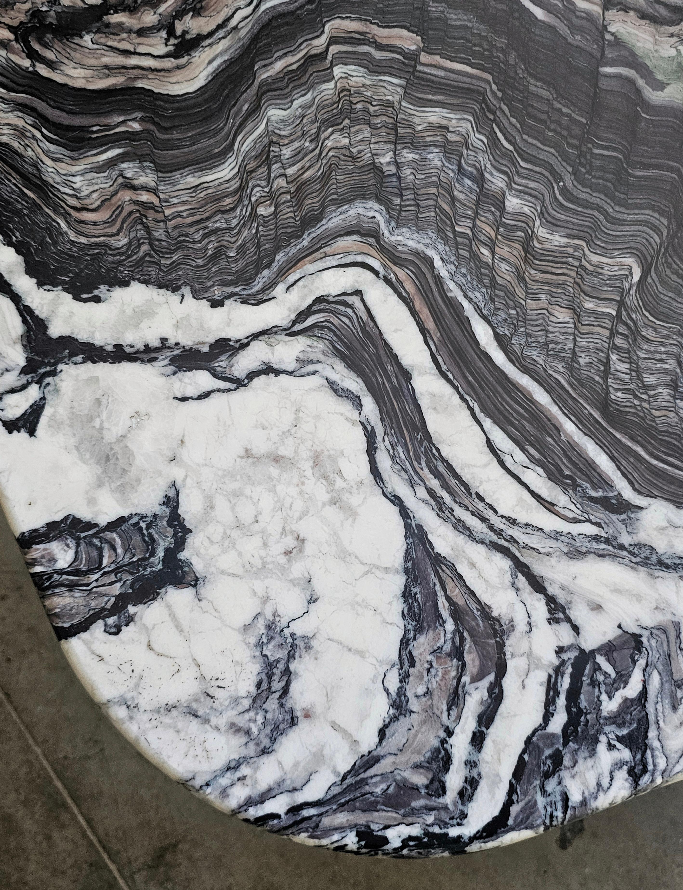 In this listing you will find a set of two Postmodern nesting tables done in Cipollino Ondulato marble with beautiful curly stone patterns in various tones of violet, green and grey. Tables are designed in style of Roche Bobois. Made in Italy in