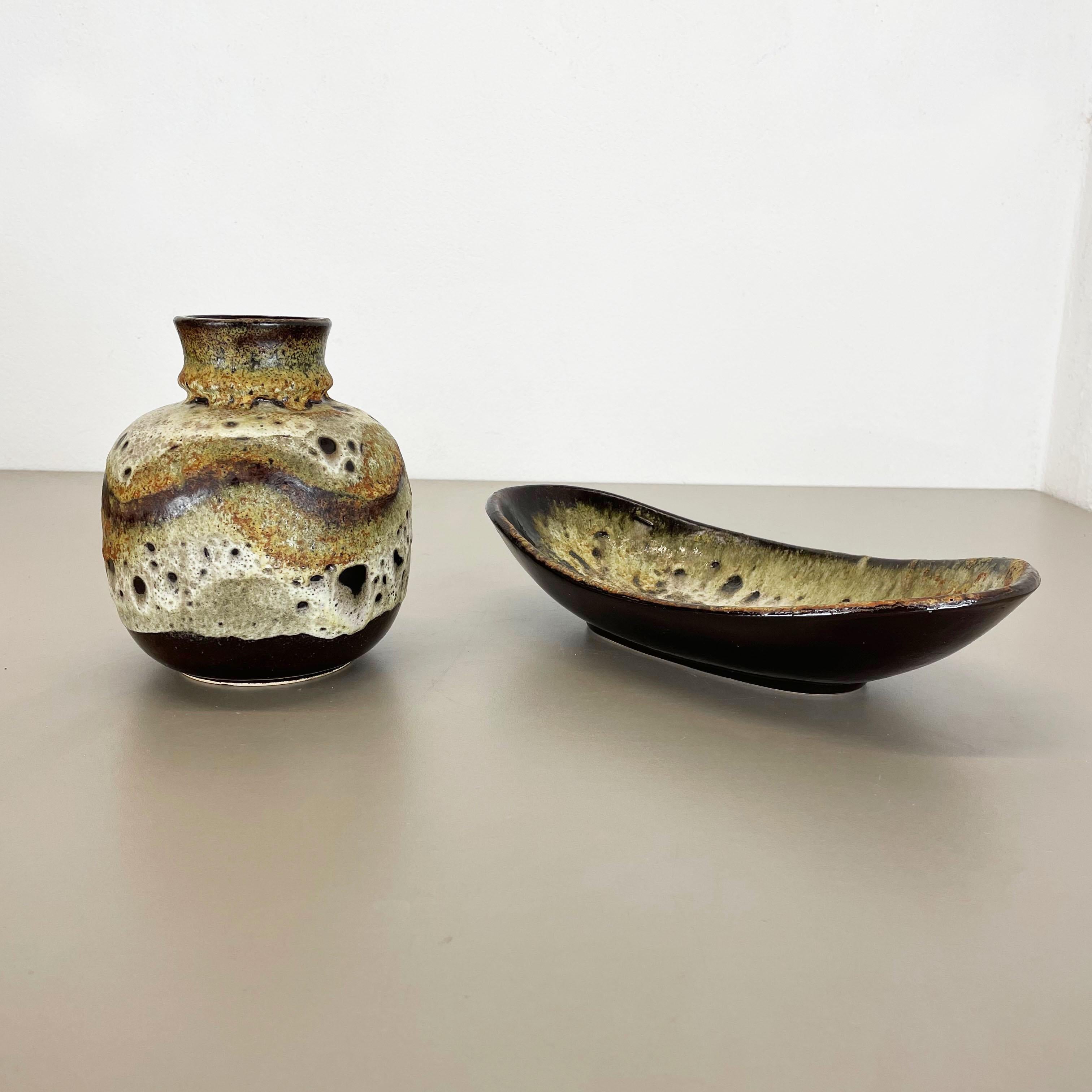 Article:

set of 2 pottery ceramic elements


Producer:

Ruscha, Germany



Decade:

1960s


Description:

This original vintage ceramic set was designed and produced in the 1960s by Ruscha in Germany. This offer contains a set of