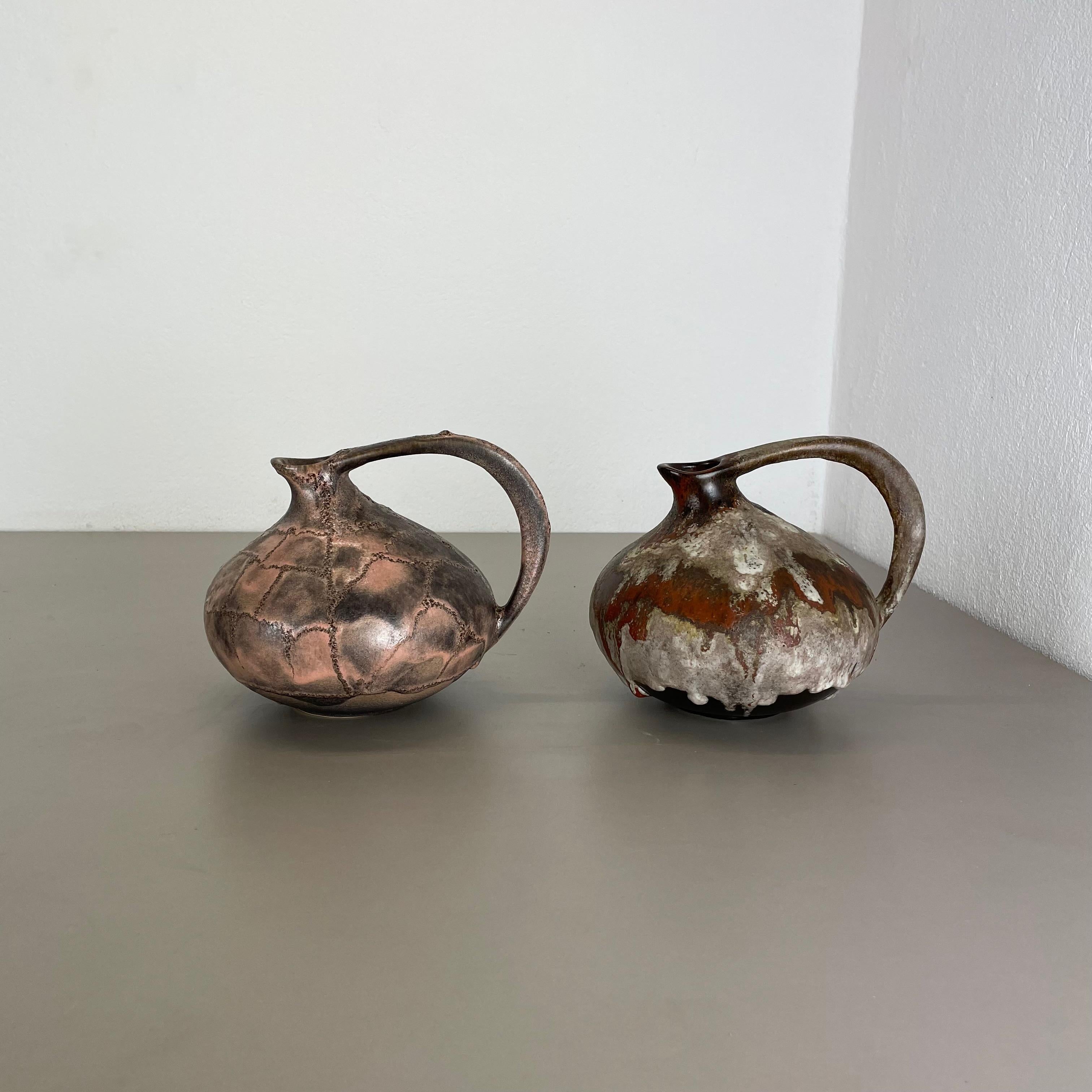 Article:

set of 2 vases


Design:

Kurt Tschörner



Producer:

Ruscha, Germany



Decade:

1960s


Description:

This original vintage vase set was designed by Kurt Tschörner and produced in the 1960s by Ruscha in Germany.