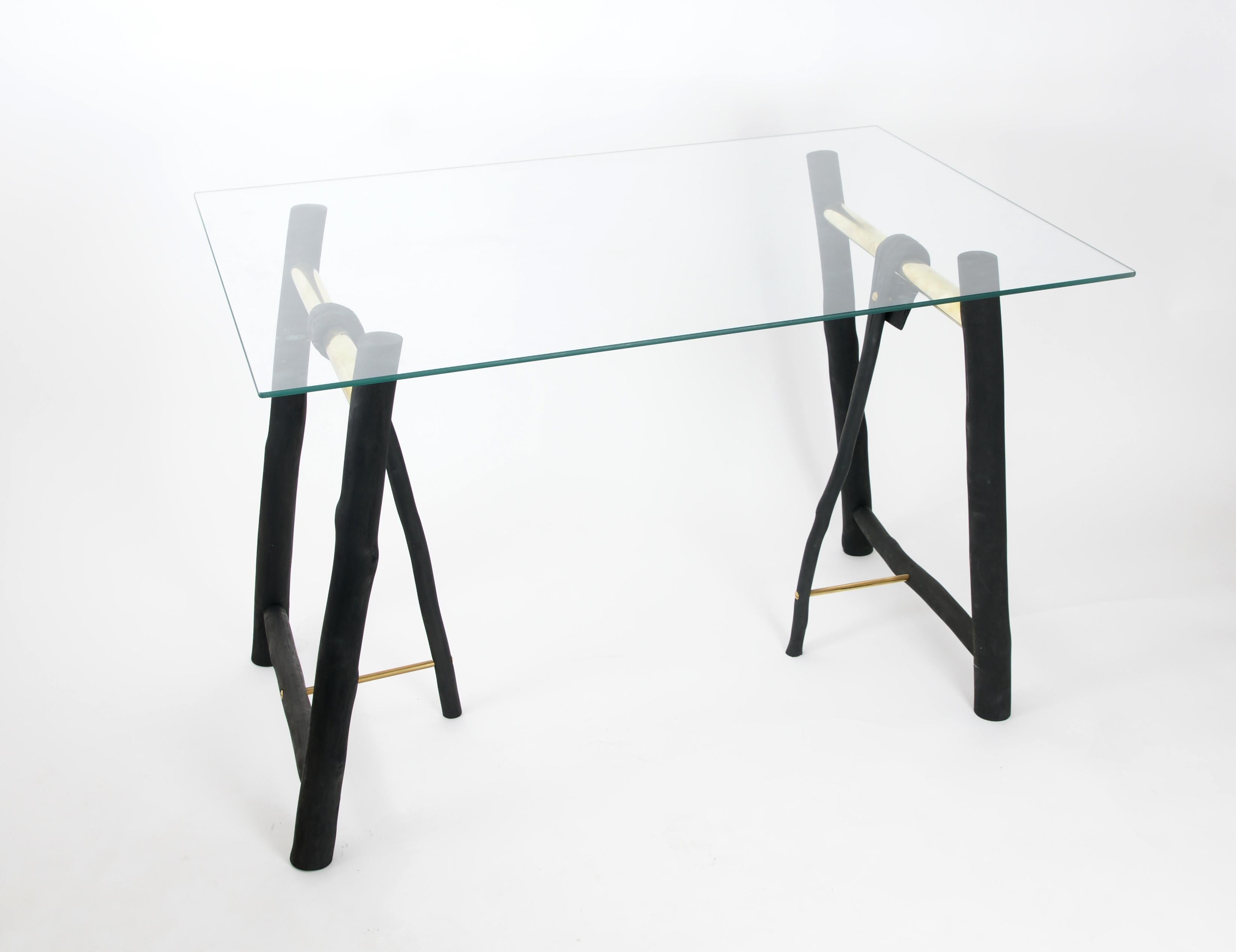Set of 2 pressed wood trestle by Johannes Hemann.
The glass top is not included.
Materials: Wood, brass, glass
Dimensions: H 78 cm x D 35 cm x W 60 cm.

The series 