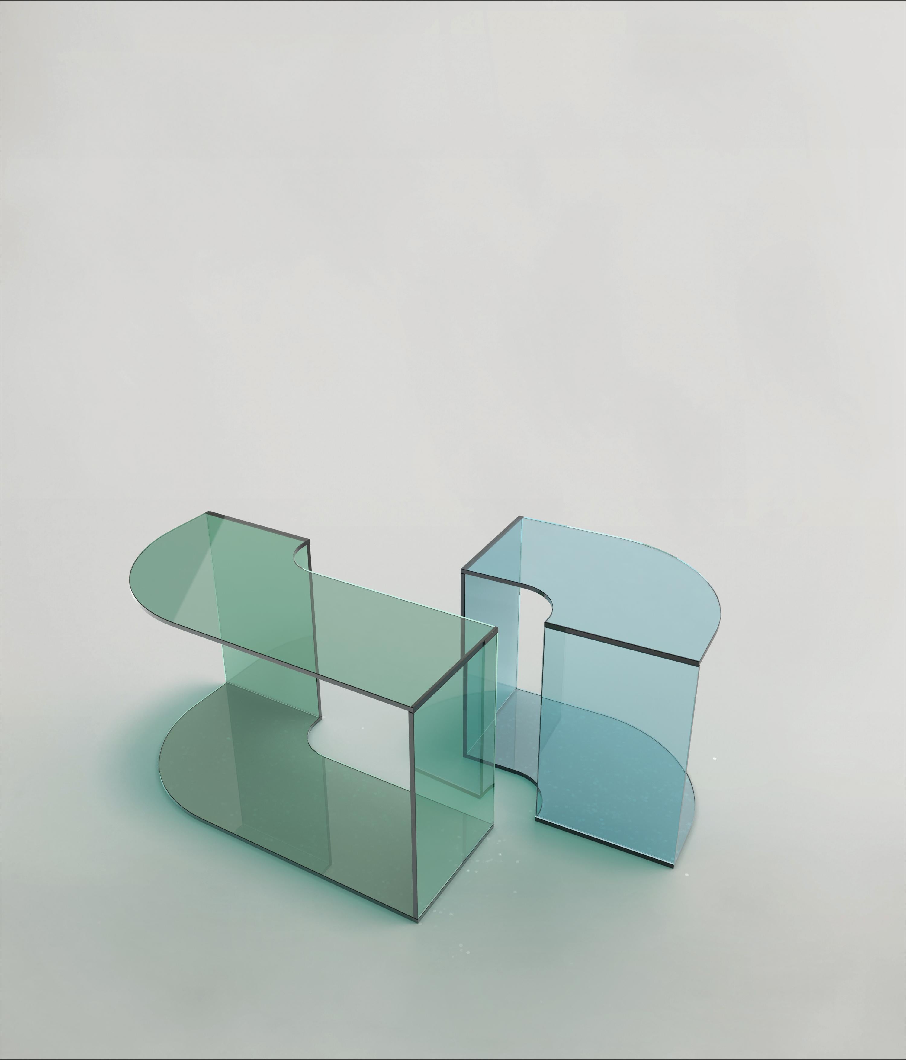 Set of 2 Quarter V1 and V2 Tables by Edizione Limitata
Limited Edition of 1000 pieces. Signed and numbered.
Dimensions: D70 x W35 x H41 cm
Materials: Blue Finish Shiny Glass,Green Shiny Glass

Quarter is a collection of contemporary side tables made