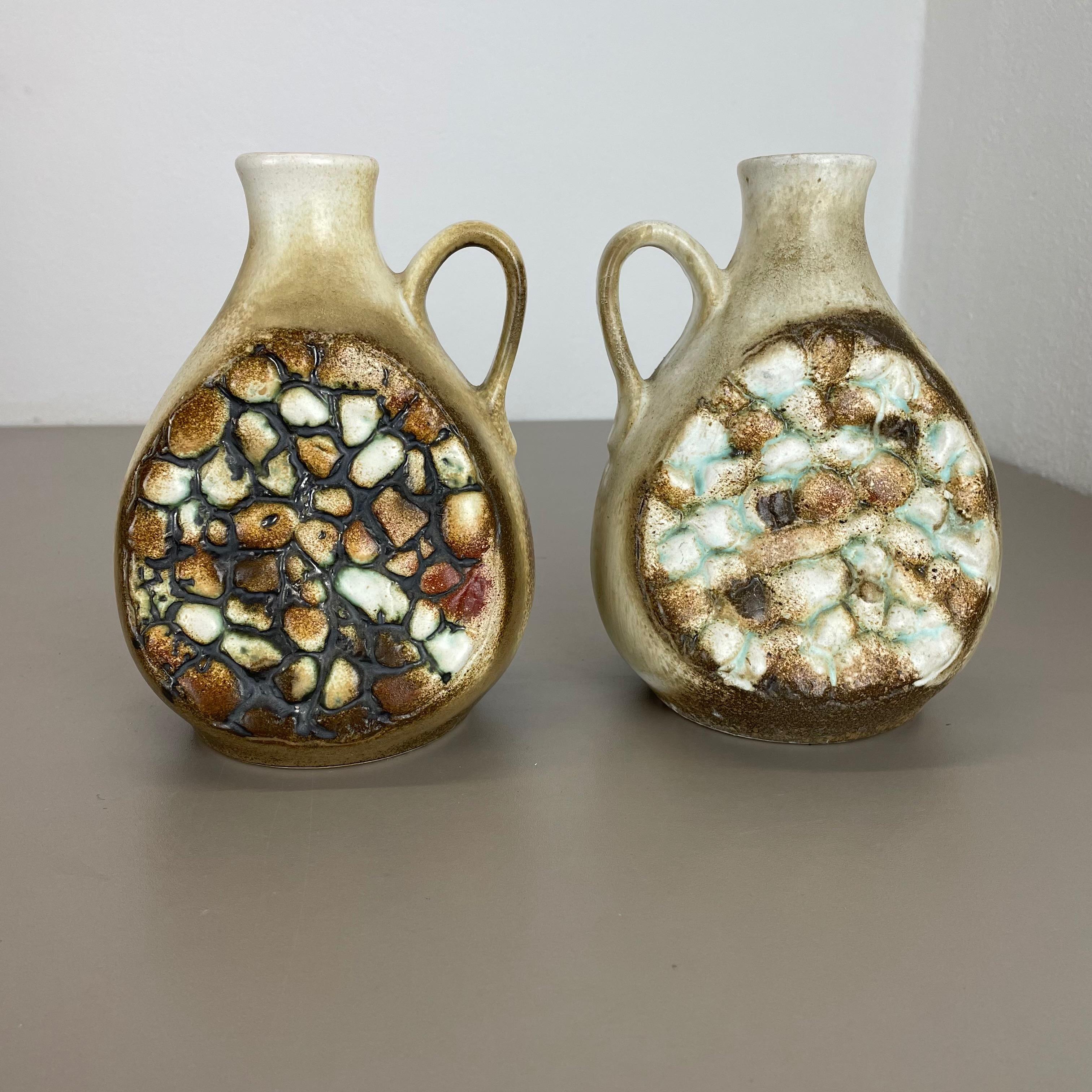 Article:

Pottery ceramic vase set of 2


Producer:

Dümler and Breiden, Germany


Decade:

1960s



Description:

Original vintage 1960s pottery ceramic vases in Germany. High quality German production with a nice abstract