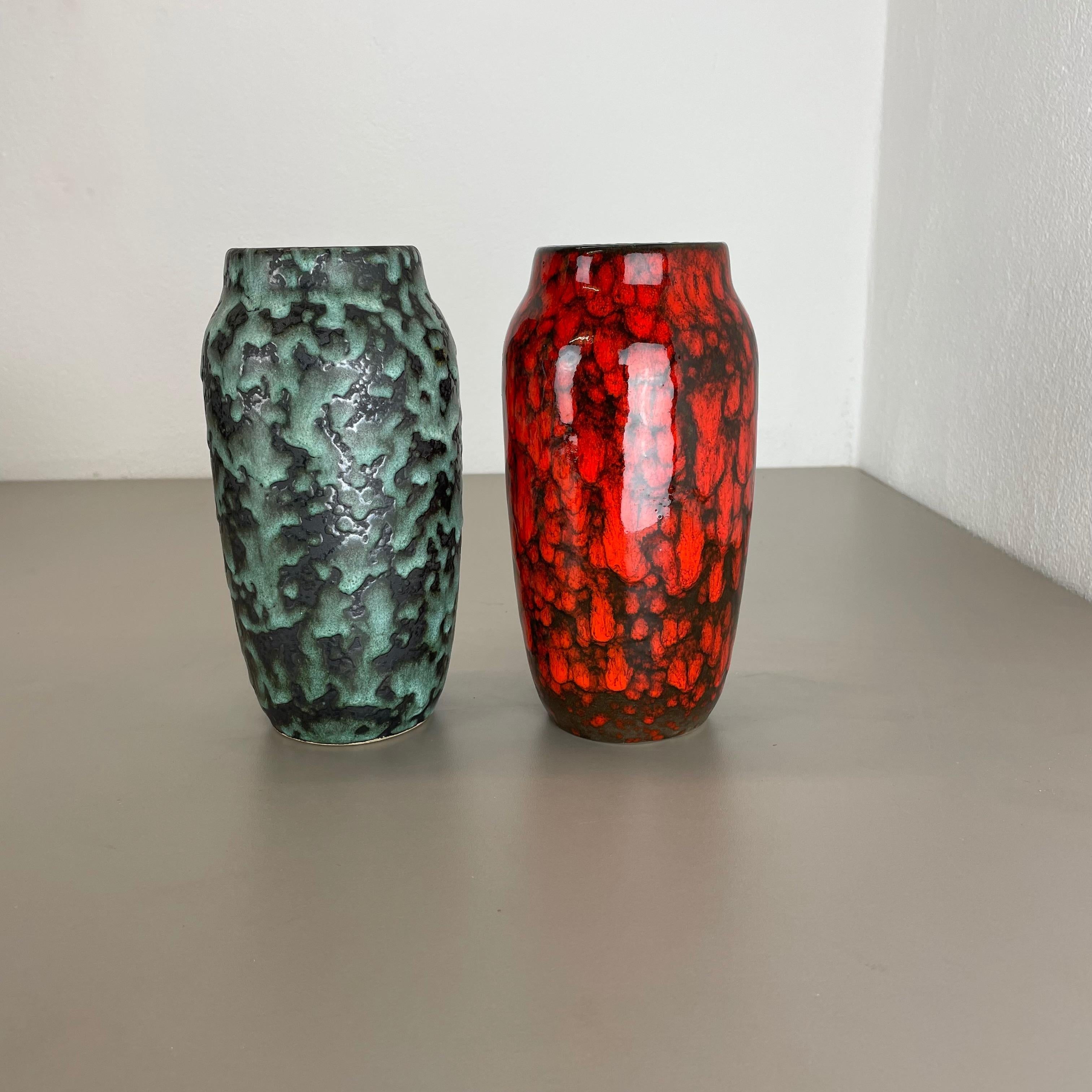 Article:

Fat lava art vase, set of 2


Producer:

Scheurich, Germany



Decade:

1970s




This original vintage vase set was produced in the 1970s in Germany. It is made of ceramic pottery in fat lava optic with abstract