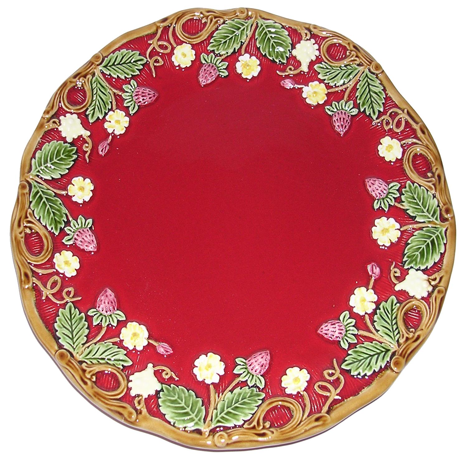 Juego de dos platos de postre rojos de la colección George Sand.

Este plato de postre está adornado con un dibujo en relieve de fresas, hojas de fresa y pequeñas flores blancas, cuidadosamente dispuestas alrededor de su borde. Su centro rojo