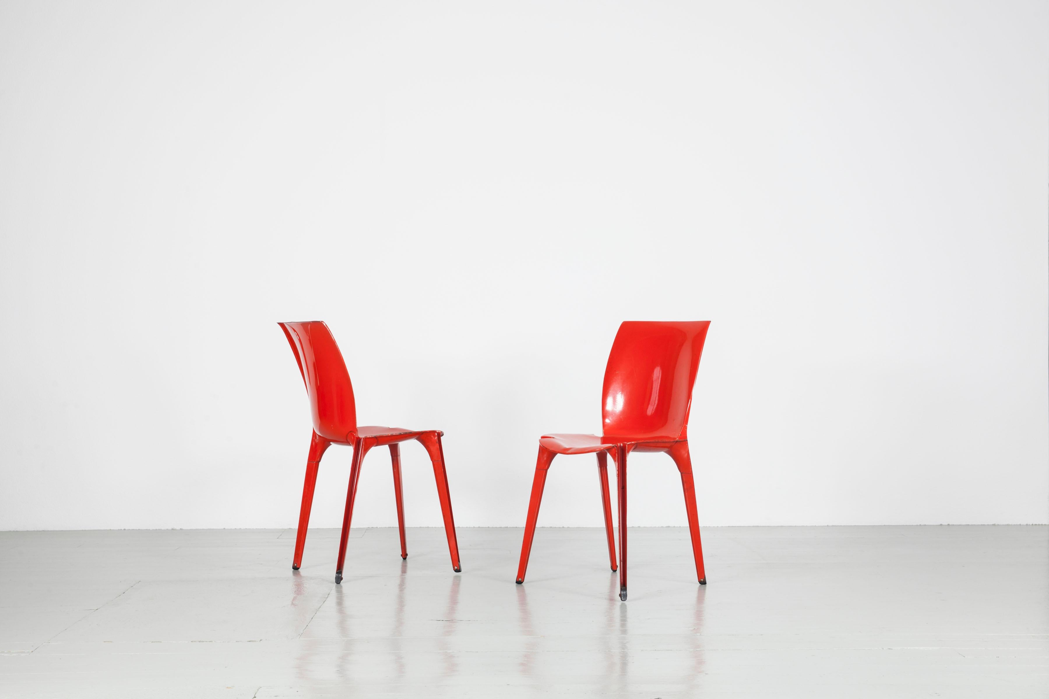 This set of two red chairs with the model name 
