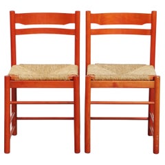 Set of 2 red vintage wooden chairs from the 1970s with a woven wicker seat