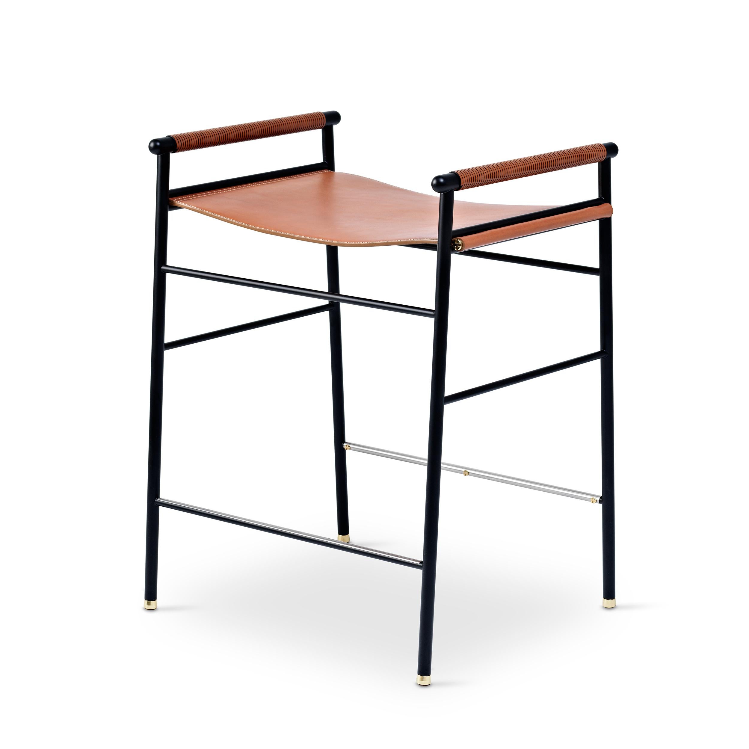 The “Repose” contemporary counter stool belongs to a collection that revisit the director chair collection, serene pieces where exclusivity and precision are shown in small details such as the hand-turned metal nuts and bolts that fix the leather