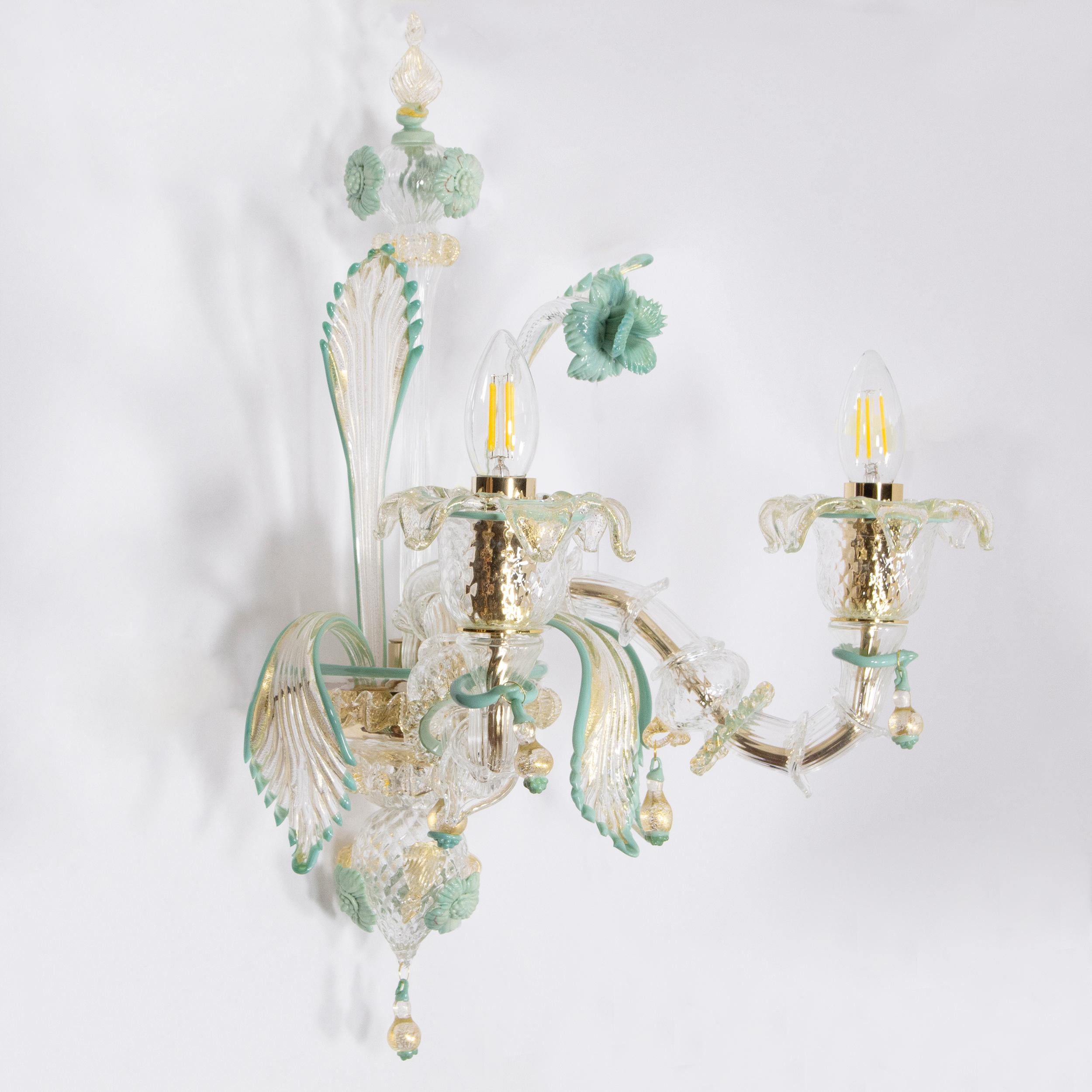 Set of 2 Rezzonico sconce 2 lights, clear Murano glass with gold, grey and green color details in vitreous paste by Multiforme.
This rezzonico sconce is a combination of the traditional Venetian structure with gaudy colors. This sconce is a peculiar