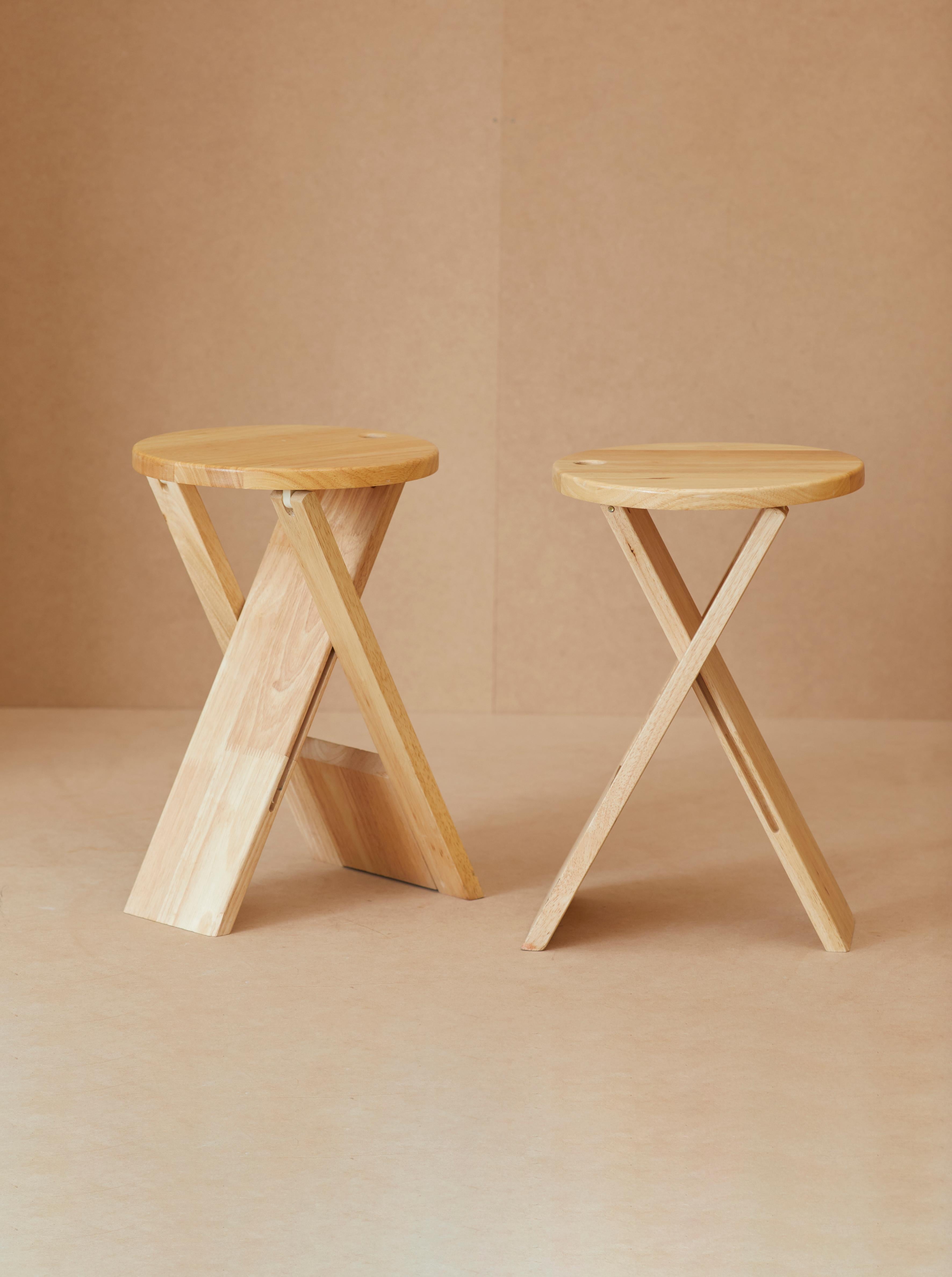 A set of 2 folding stools by Roger Tallon for Maison Sentou, France c. 1970. 

A smart and practical design in solid beech wood that can be folded and hung.  