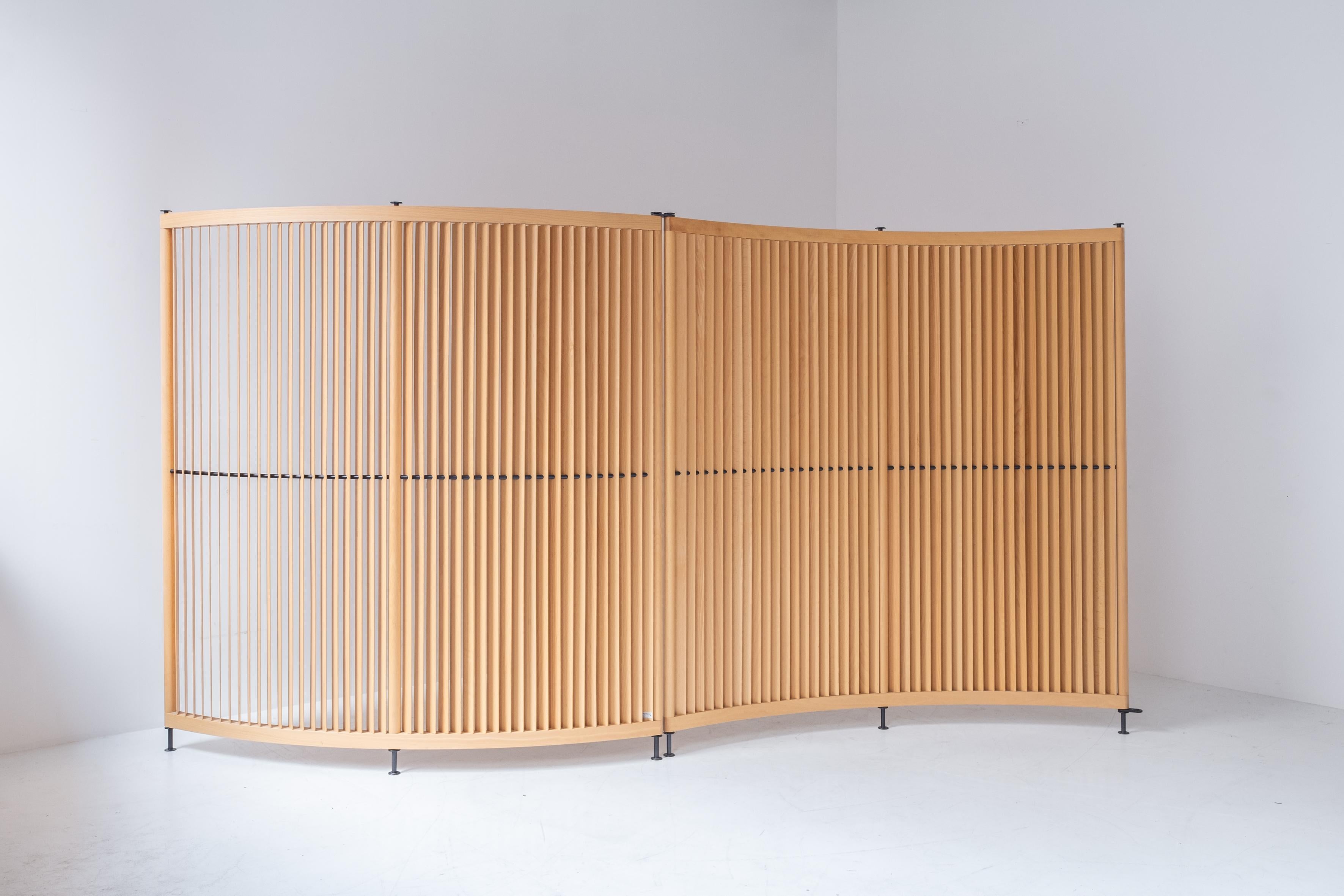 Set of 2 identical room dividers model ‘Labyrinth’ designed by Niels Gammelgaard and Lars Mathiesen under their brand name ‘Pelikan Design’ for Fritz Hansen, Denmark 1990’s. These room dividers features solid beech slats and black metal legs. Both
