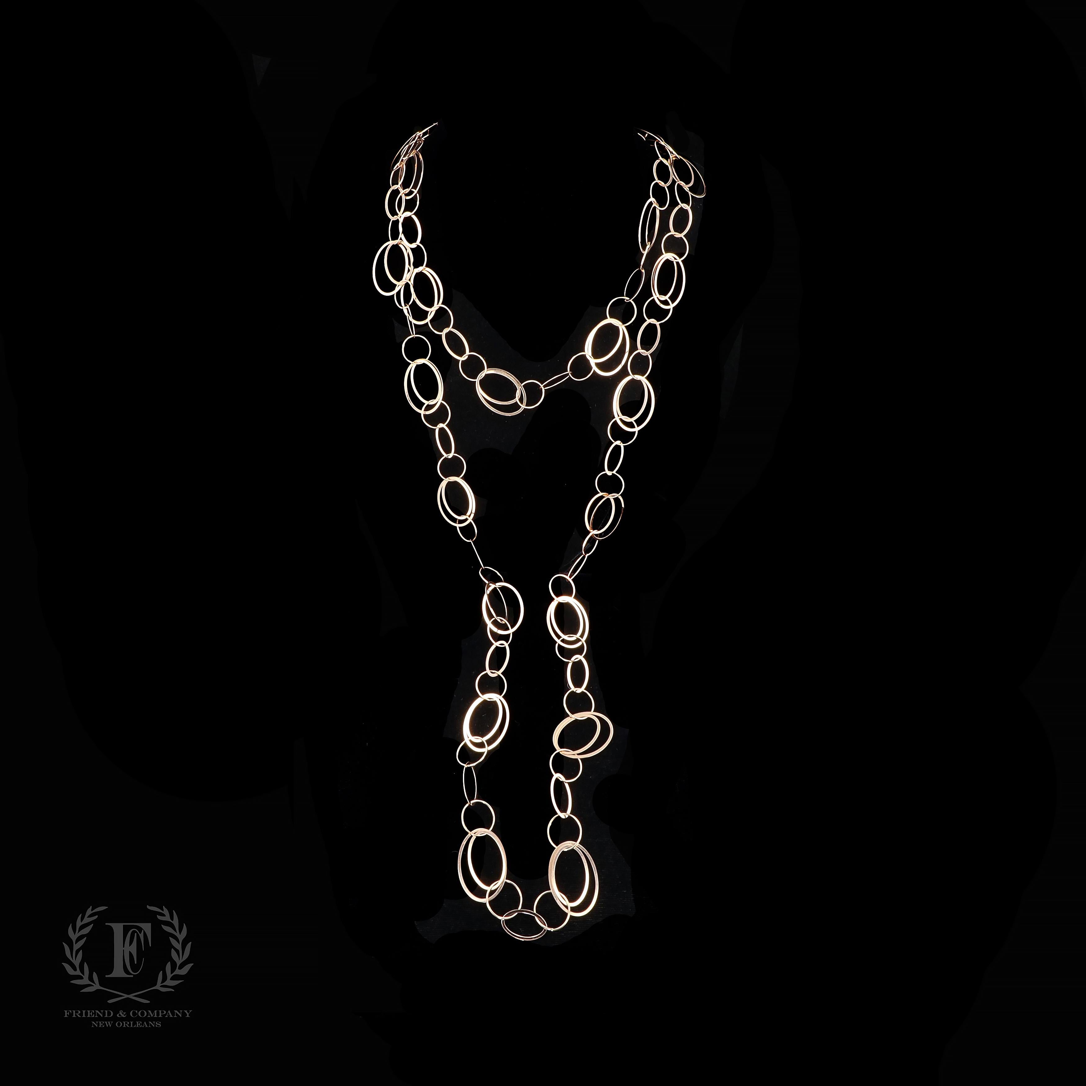 This set of two 14 karat rose gold necklaces feature multi-shape hoop links that combine with incredible shine and movement. The necklaces measure 35.25 inches and 23.25 inches in length. The set is stamped 14K and weighs 34.8 grams.