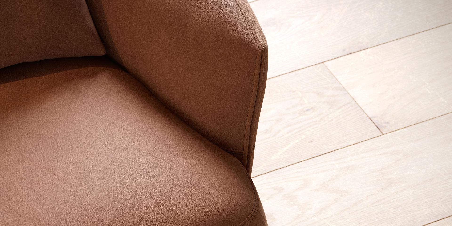 Designed with comfort in mind, this armchair is a compact, round-shaped seating solution that fits seamlessly into any room. This versatile piece features a swivel base that effortlessly returns to its original position after use, ensuring a tidy