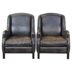 Lote de 2 sillones de cuero vacuno negro rugoso con respaldo alto, estilo industrial
