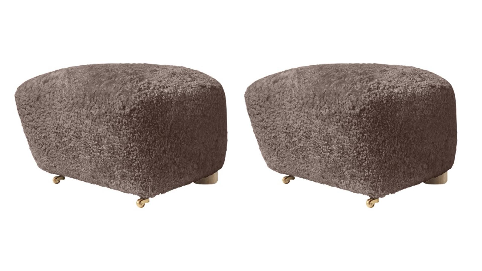 Set of 2 sahara natural oak sheepskin the tired man footstools by Lassen
Dimensions: W 55 x D 53 x H 36 cm 
Materials: Sheepskin

Flemming Lassen designed the overstuffed easy chair, The Tired Man, for The Copenhagen Cabinetmakers’ Guild
