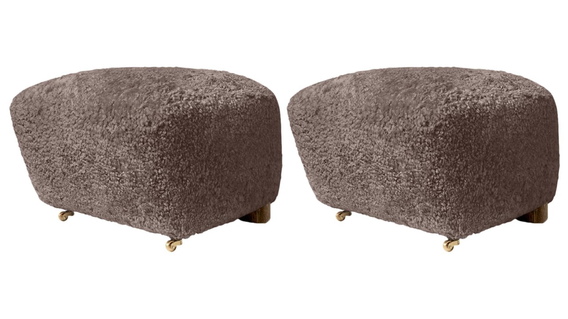 Set of 2 sahara smoked oak sheepskin the tired man footstools by Lassen
Dimensions: W 55 x D 53 x H 36 cm 
Materials: Sheepskin

Flemming Lassen designed the overstuffed easy chair, the tired man, for The Copenhagen Cabinetmakers’ Guild