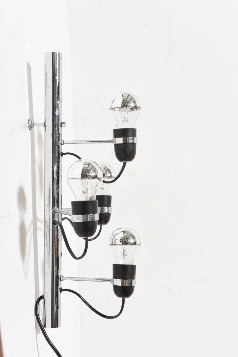 Set of four-light sconces by Gino Sarfatti, 1960st. Featering a Midcentury metal chrome hanging wall lamp with four bakelite sockets each. Very nice wall hanging up-lights for hallway or living-room.