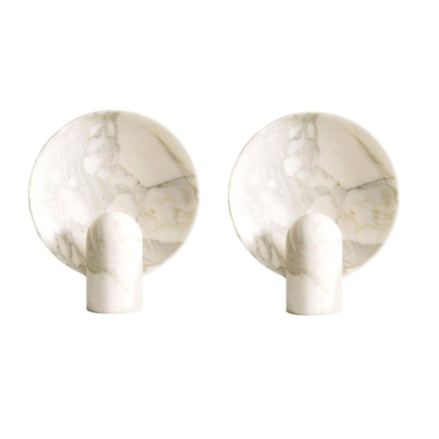 Set of 2 sculpted calacatta marble by Henry Wilson
This sculptural item is handmade in Sydney Australia.

The surface sconce in Calacatta marble is an ambient, sculptural light carved in two halves from solid stone.

Each light is manufactured