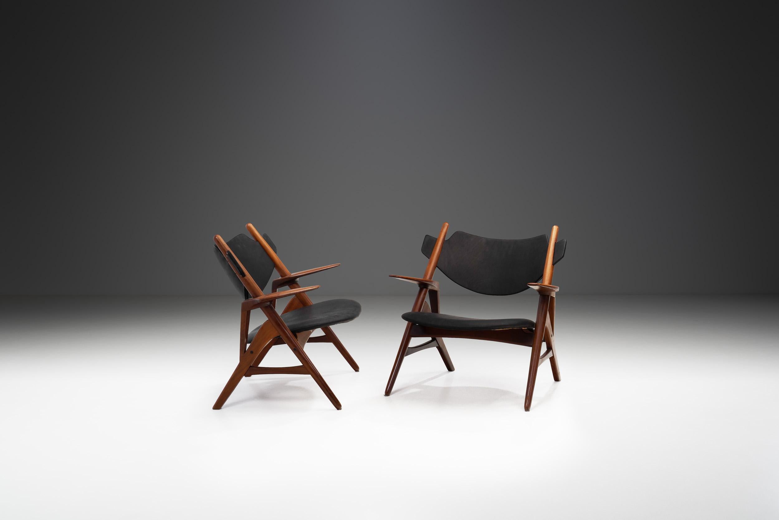 Danish Modern designers are the undisputed masters of mid-century modern chair design. As this pair shows, their furniture generally united form and function; in every design, they placed the highest demands on comfort and ergonomics. To Danish