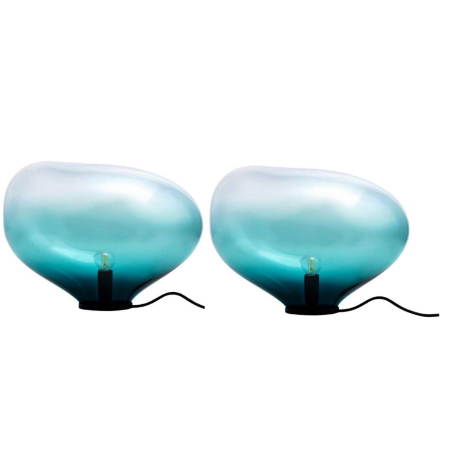 Set of 2 Sedna Petrol M Table Lamps by Eloa
No UL listed 
Material: Glass, steel, silver, LED Bulb
Dimensions: D 25 x W 38 x H 28 cm
Also available in different colours and dimensions.

All our lamps can be wired according to each country. If sold