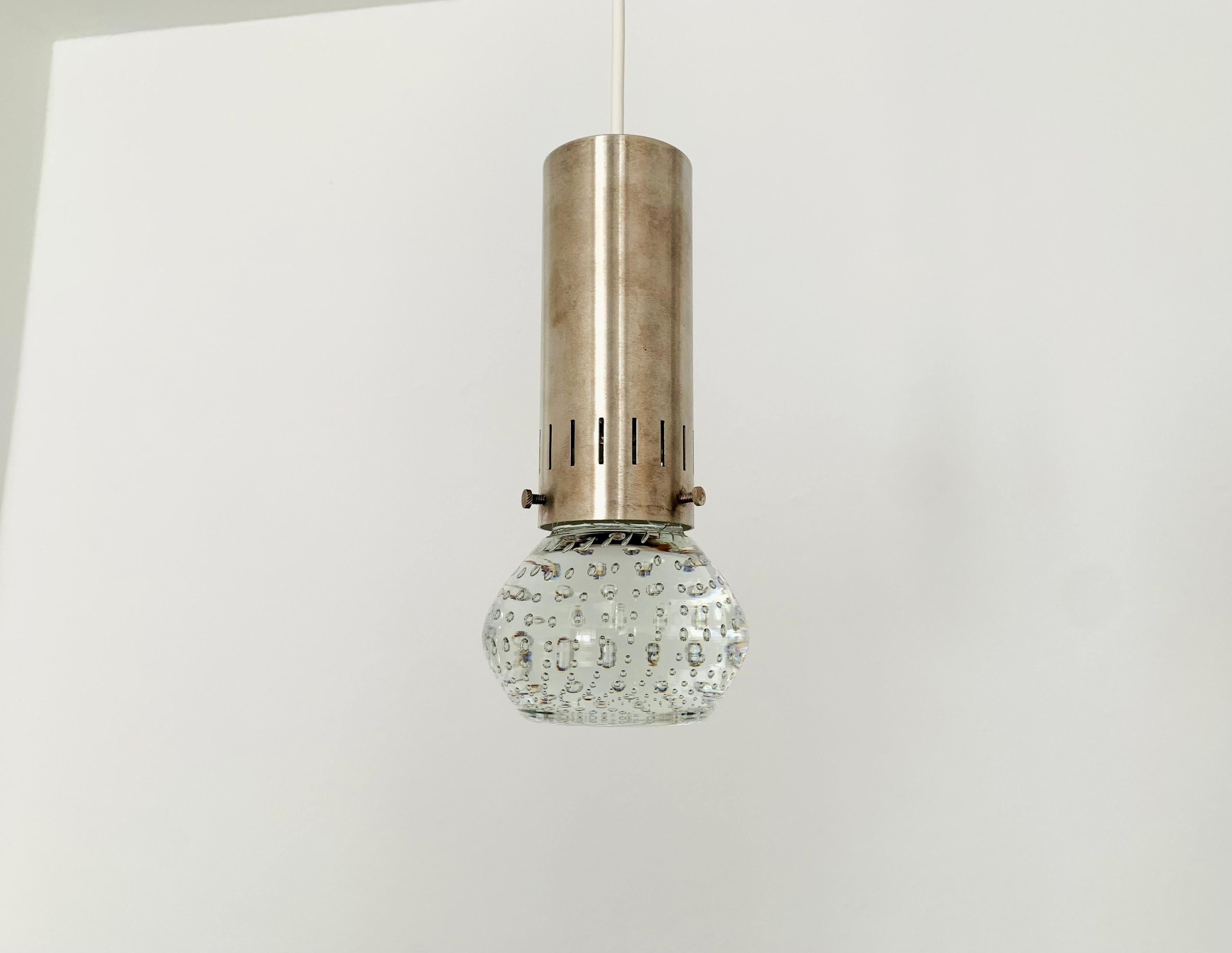 Very nice glass pendant lamps from the 1960s.
Great massive workmanship and a real eye -catcher for every home.
The air bubbles in the glass create a special light effect.

Condition:

Very good vintage condition with slight signs of use.
The metal