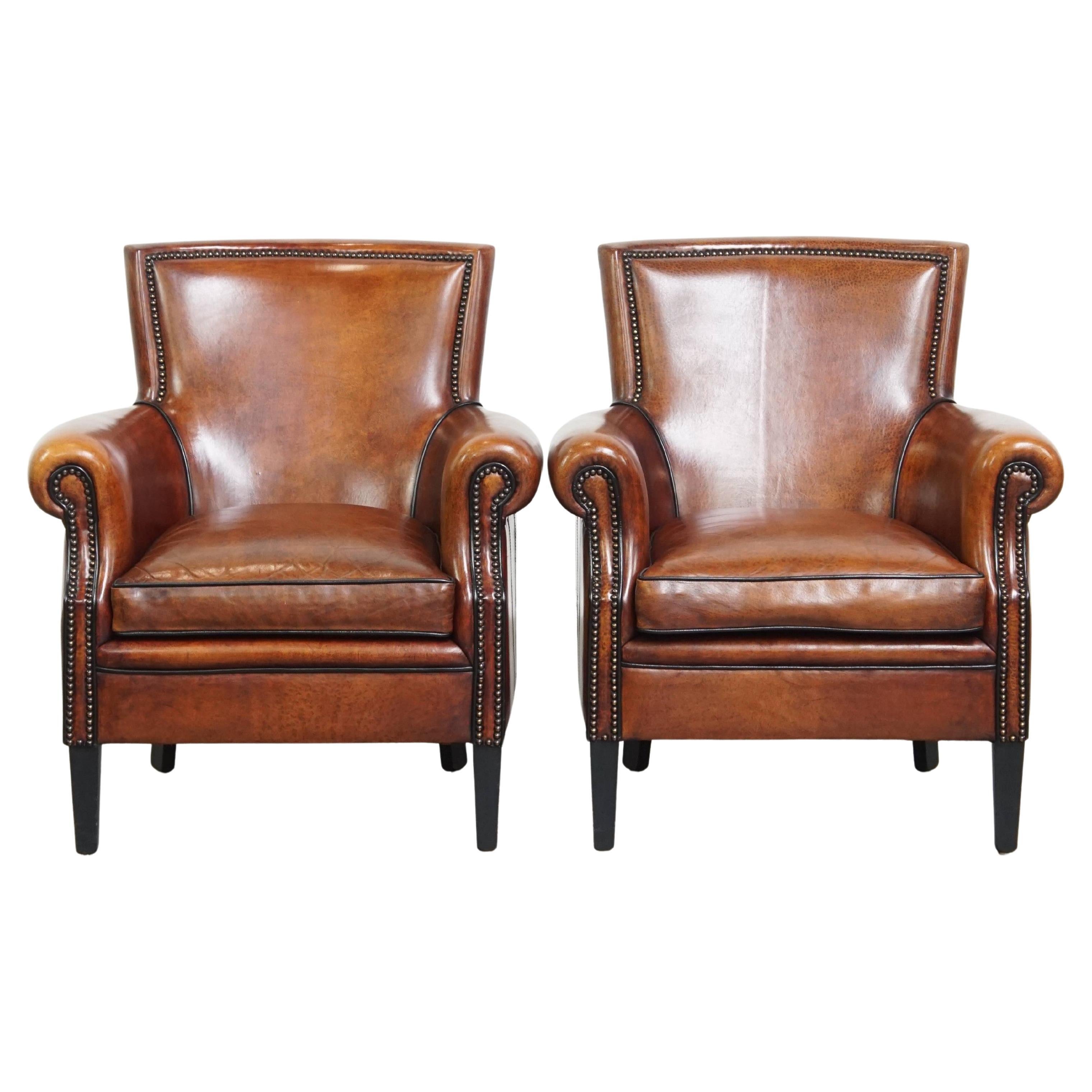 Ensemble de 2 fauteuils en cuir de mouton en vente