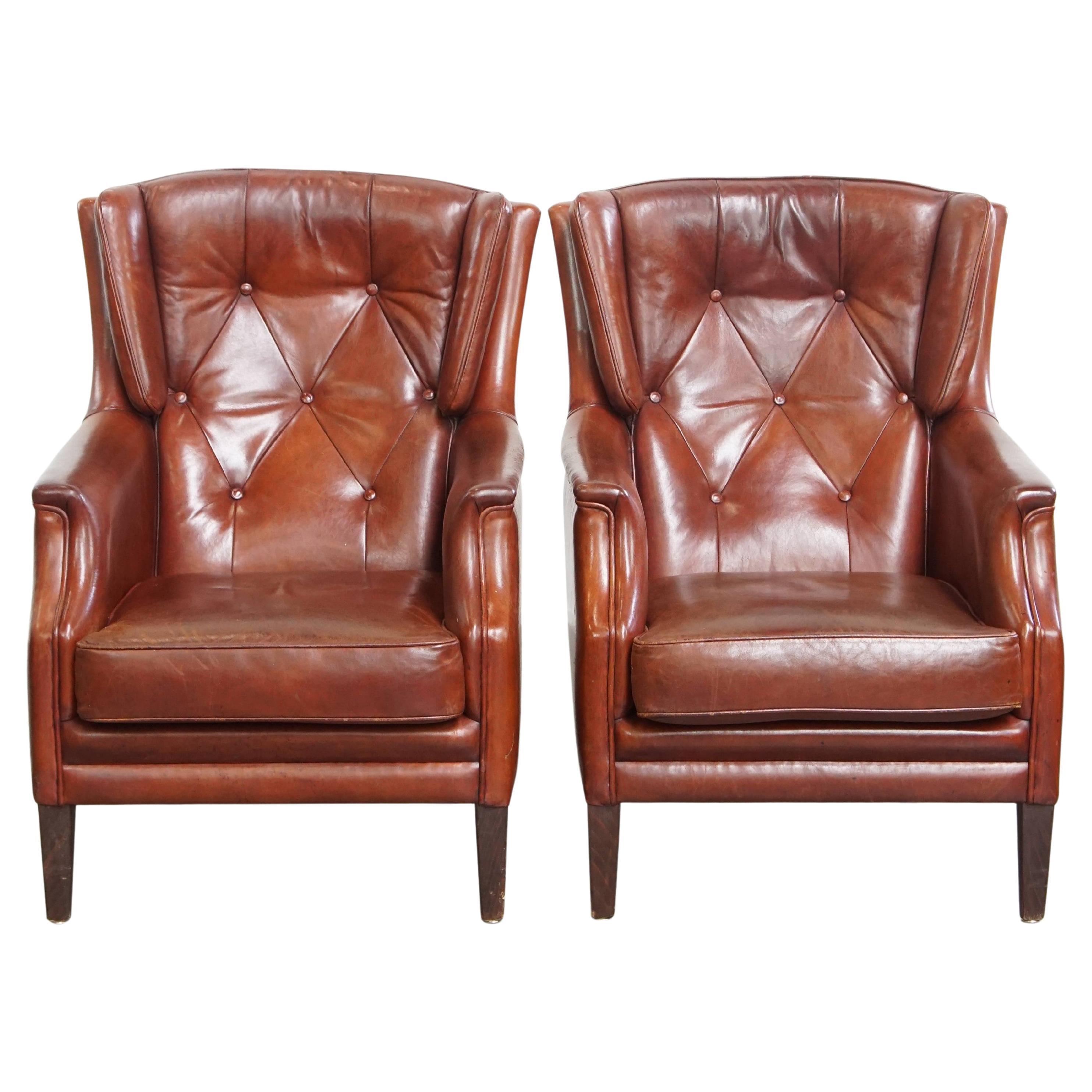 Set of 2 sheepskin leather chesterfield armchairs en venta