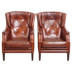 Set of 2 sheepskin leather chesterfield armchairs