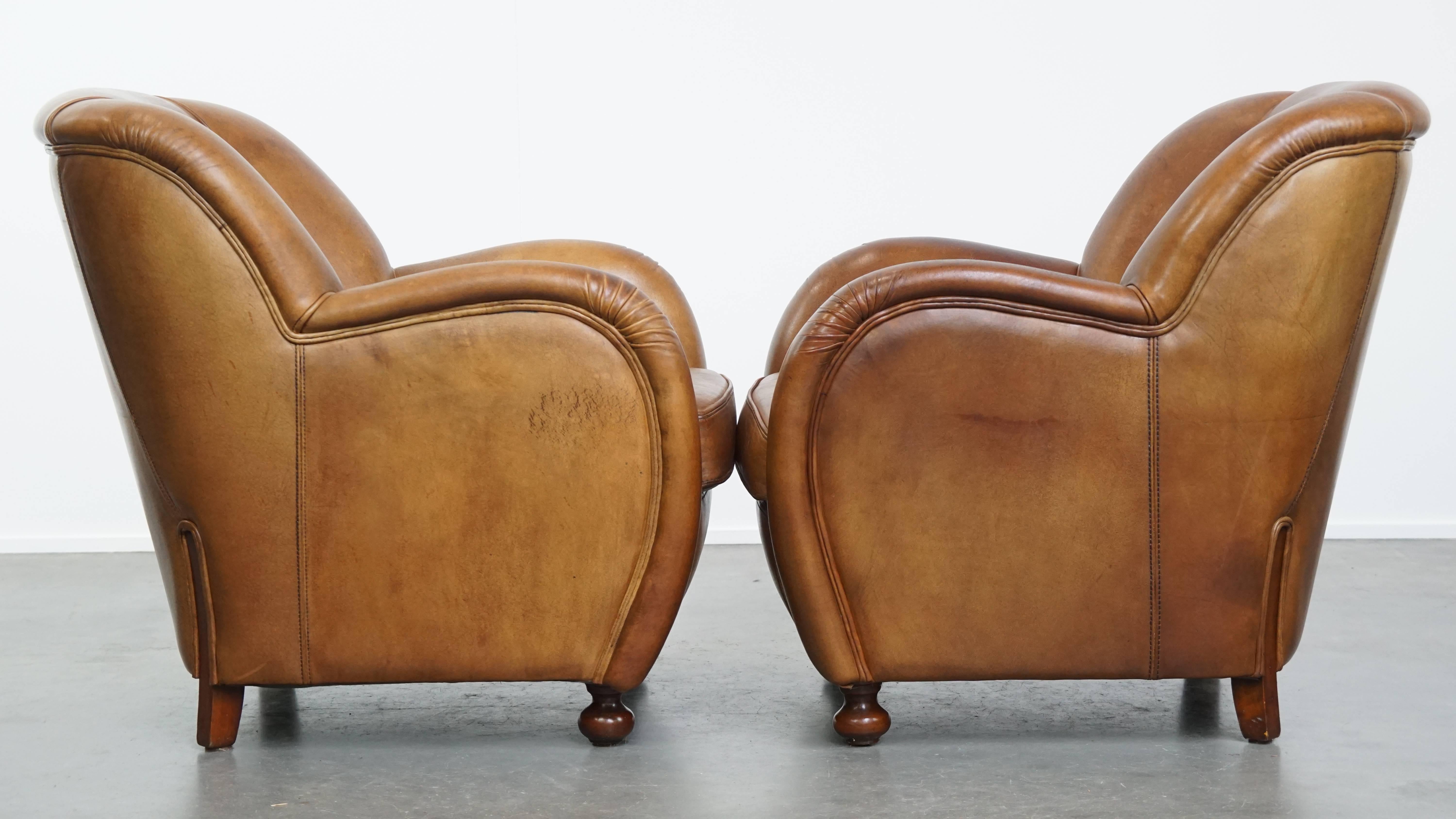 Offered here this fantastic set of 2 unique and comfortable sheepskin leather design armchairs of high quality.

A rare find for true enthusiasts! These timeless design armchairs are crafted from premium sheepskin leather and feature an elegant,