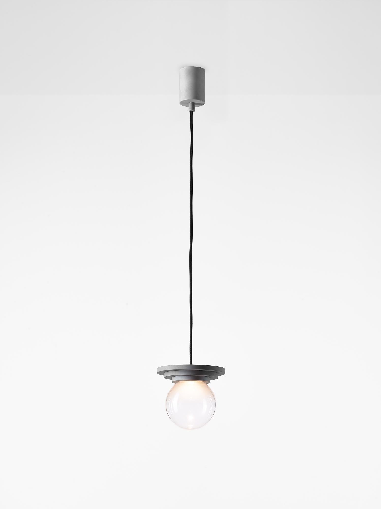 Set of 2 silver stratos mini ball pendant light by Dechem Studio.
Dimensions: D 12 x H 14 cm.
Materials: aluminum, glass.
Also available: different colours available.

Different shapes of capsules and spheres contrast with anodized alloy